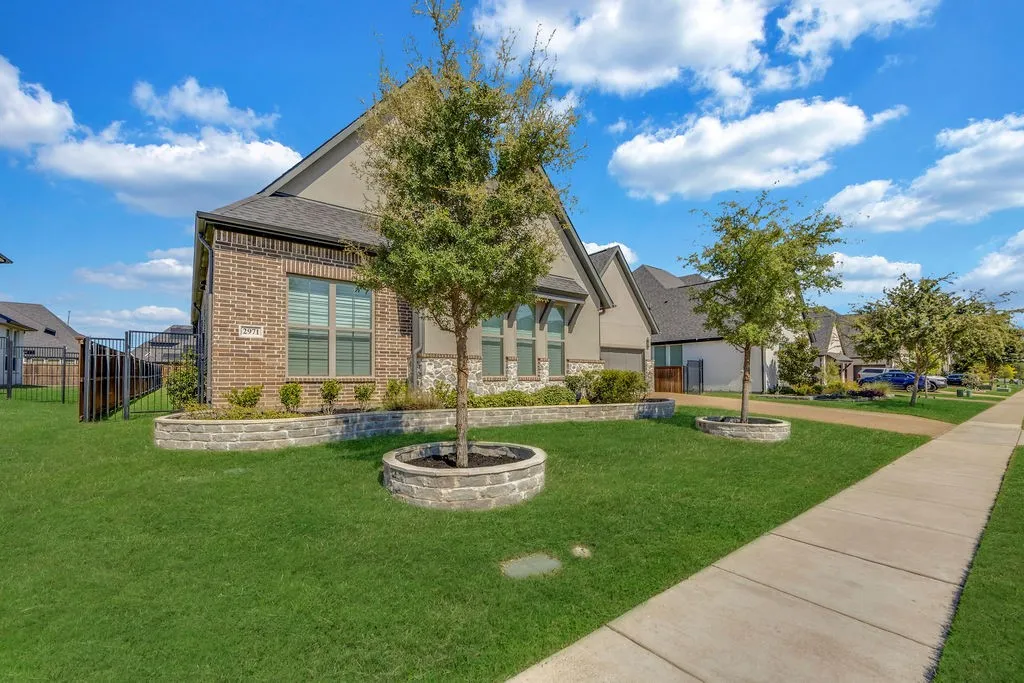 Brick and stucco exterior with multiple gables