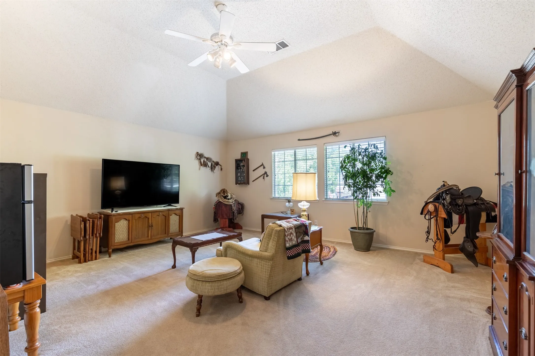 Game room with vaulted ceiling.
