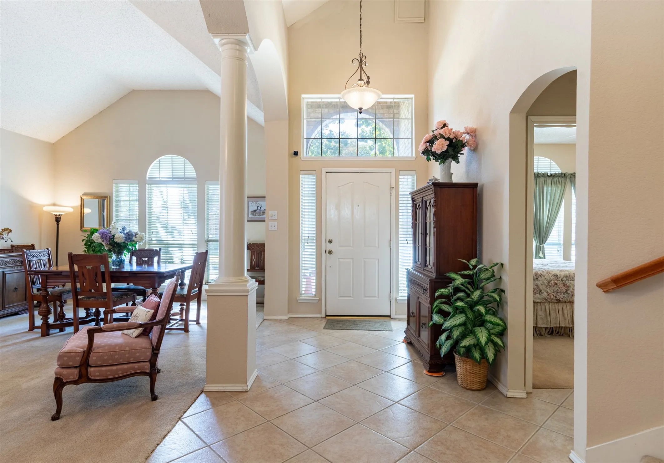 Open-concept entry to living and dining rooms.
