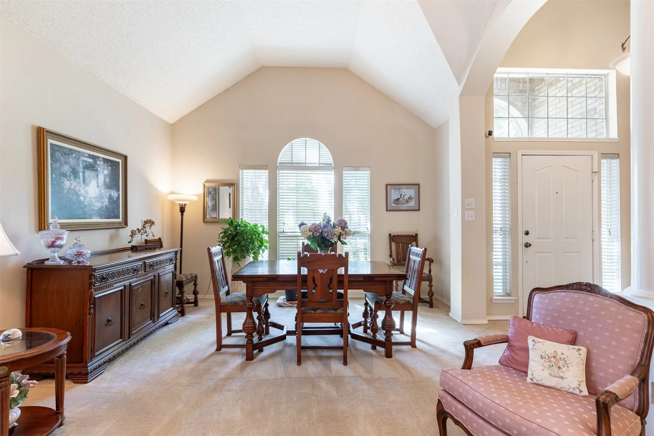 Living room (being used as dining) overlooking the front of the home.