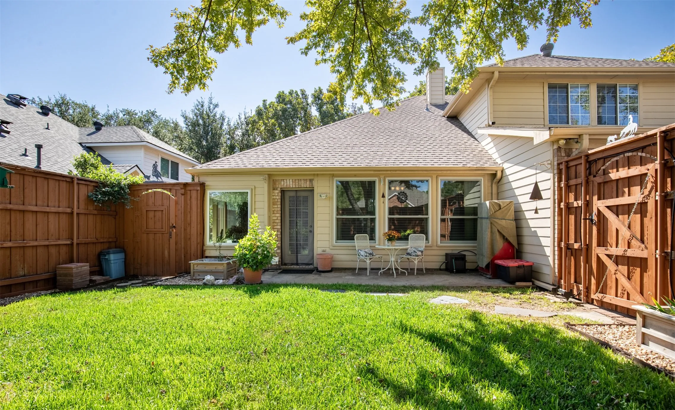 Backyard patio with side gates.