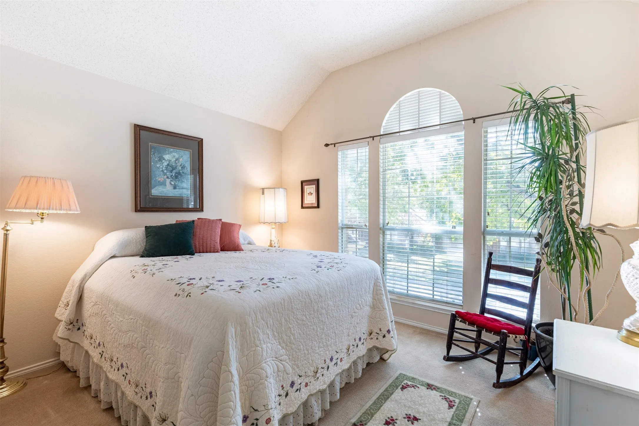 Upstairs secondary bedroom with natural light.