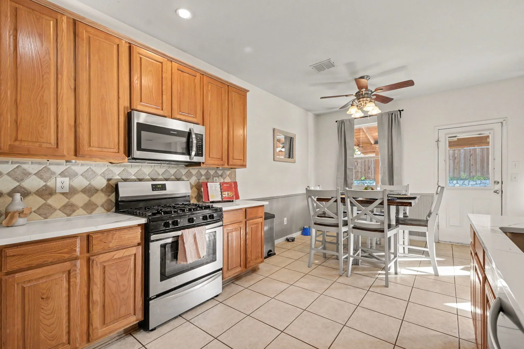 Stainless steel appliances, & new quartz counter tops .  Gas range