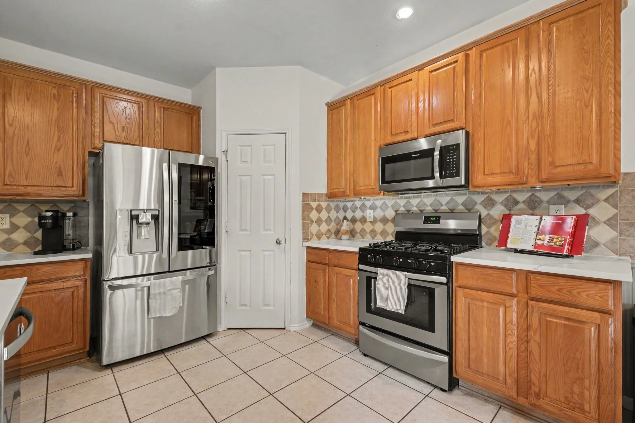 Stainless steel appliances, & new quartz counter tops .  Gas range