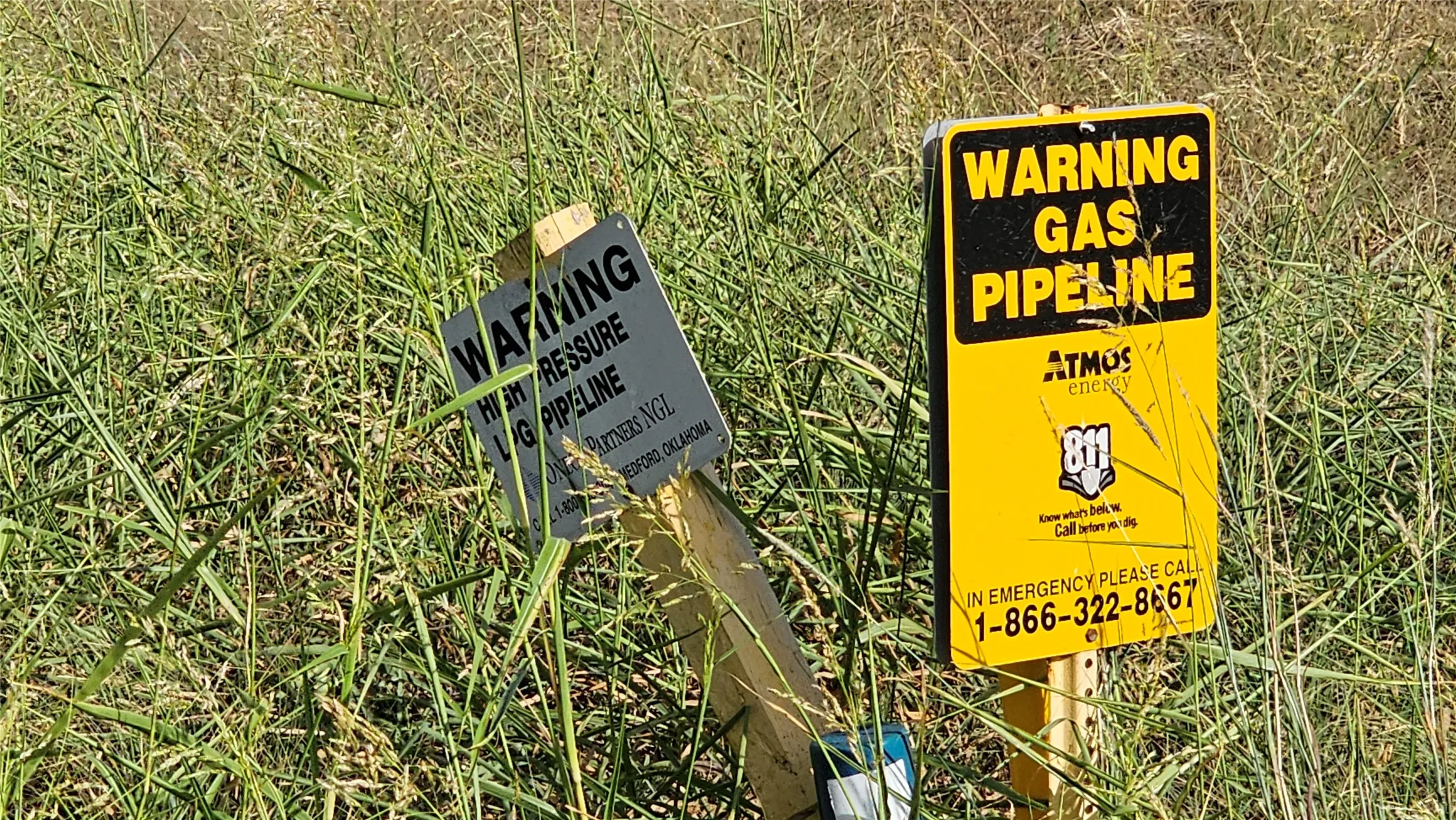 Found in the neighboring yard is a gas pipeline sign; underground pipe appears to traverse subject property.