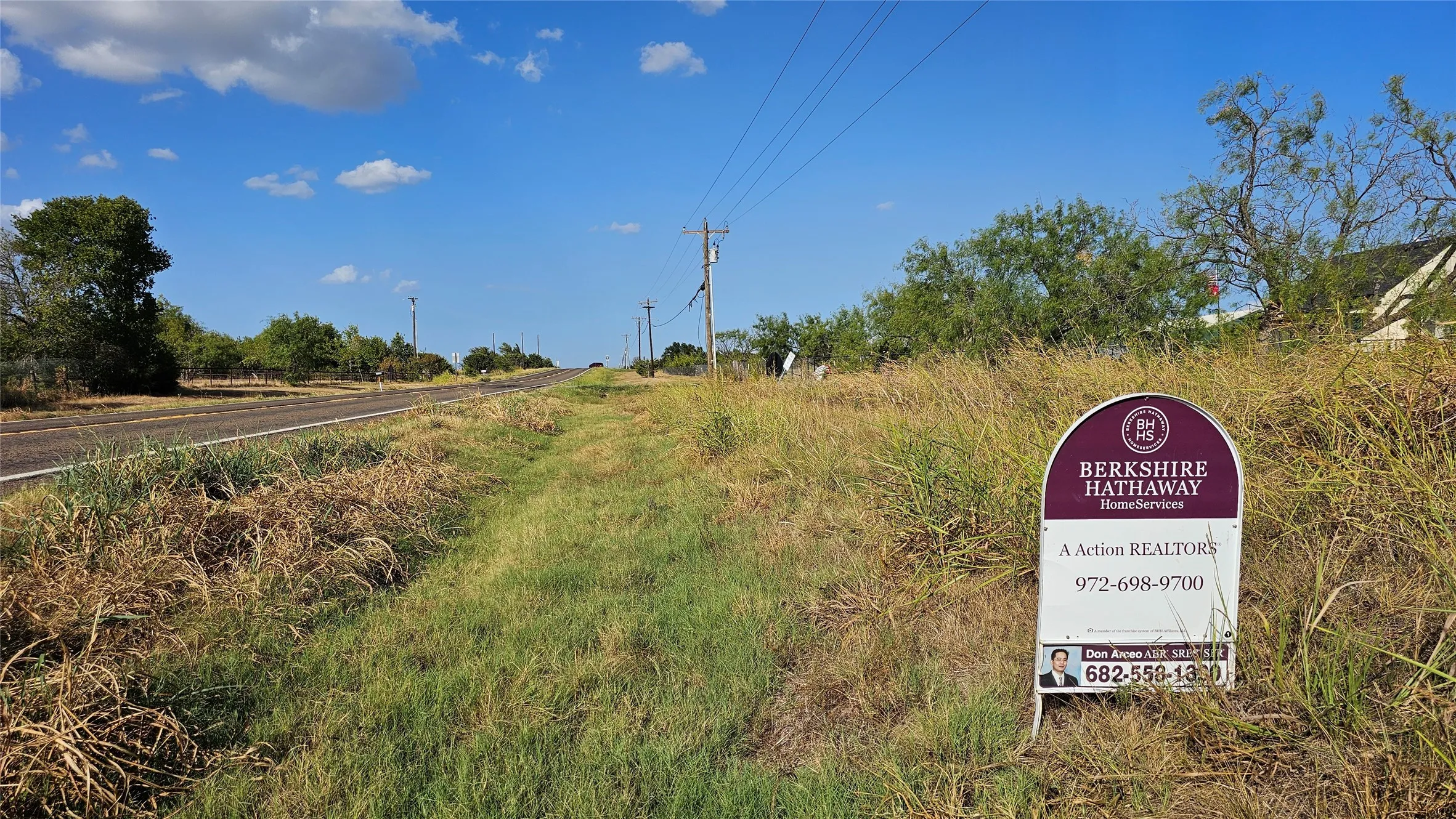 View showing road frontage looking toward northeast.