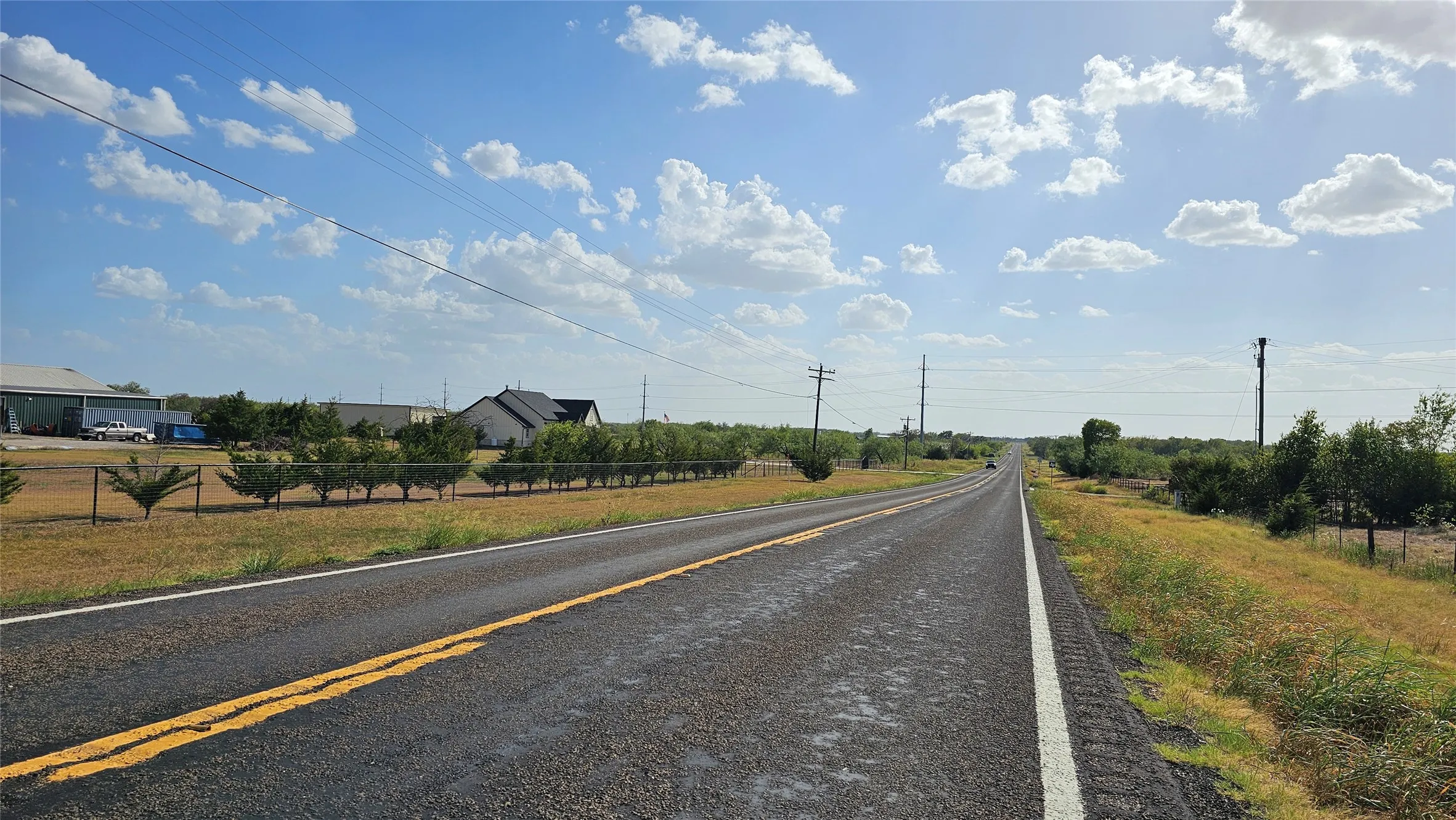 Road view toward the property going southwest.