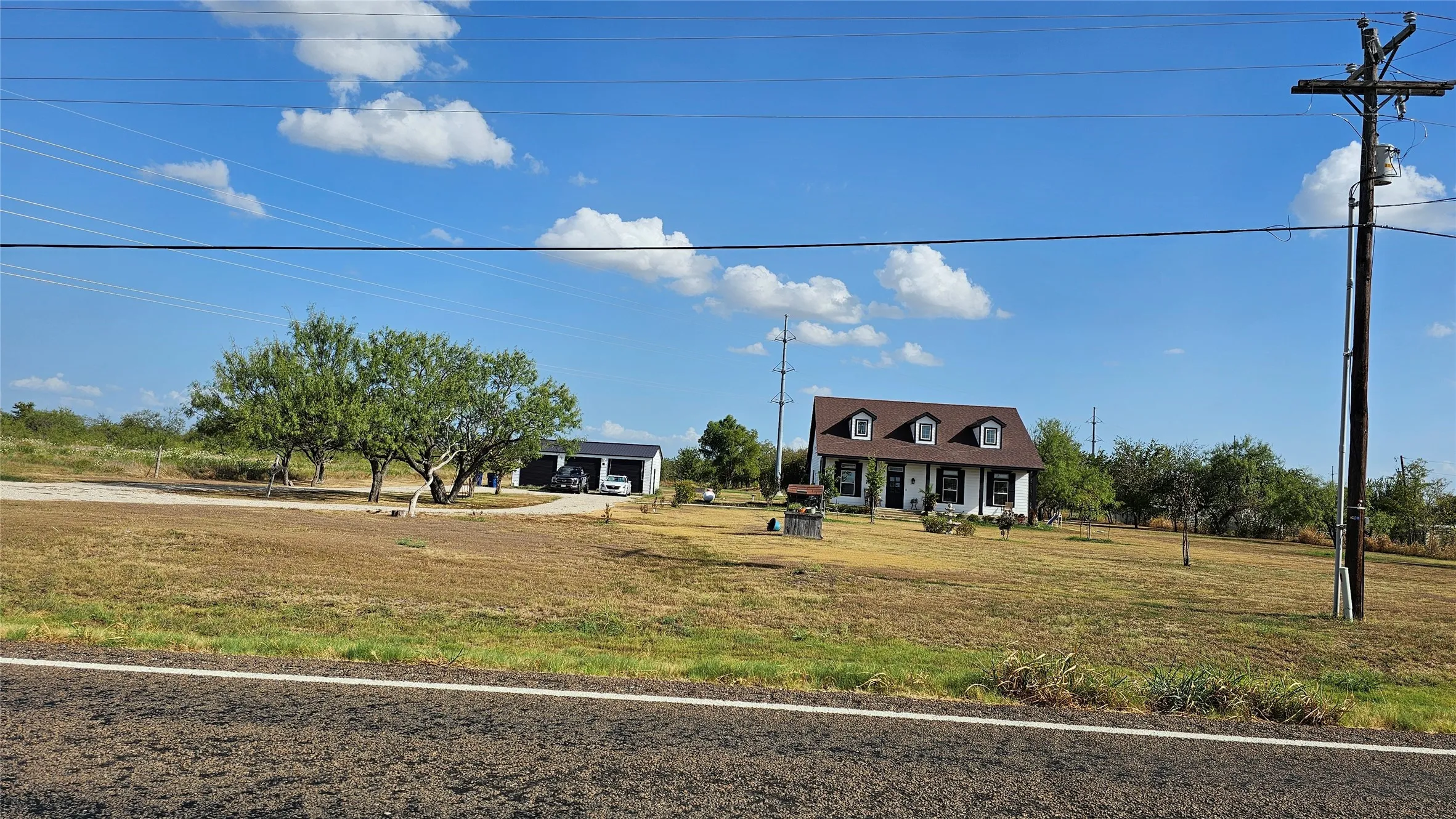View from the road of neighboring structure, south of the property.
