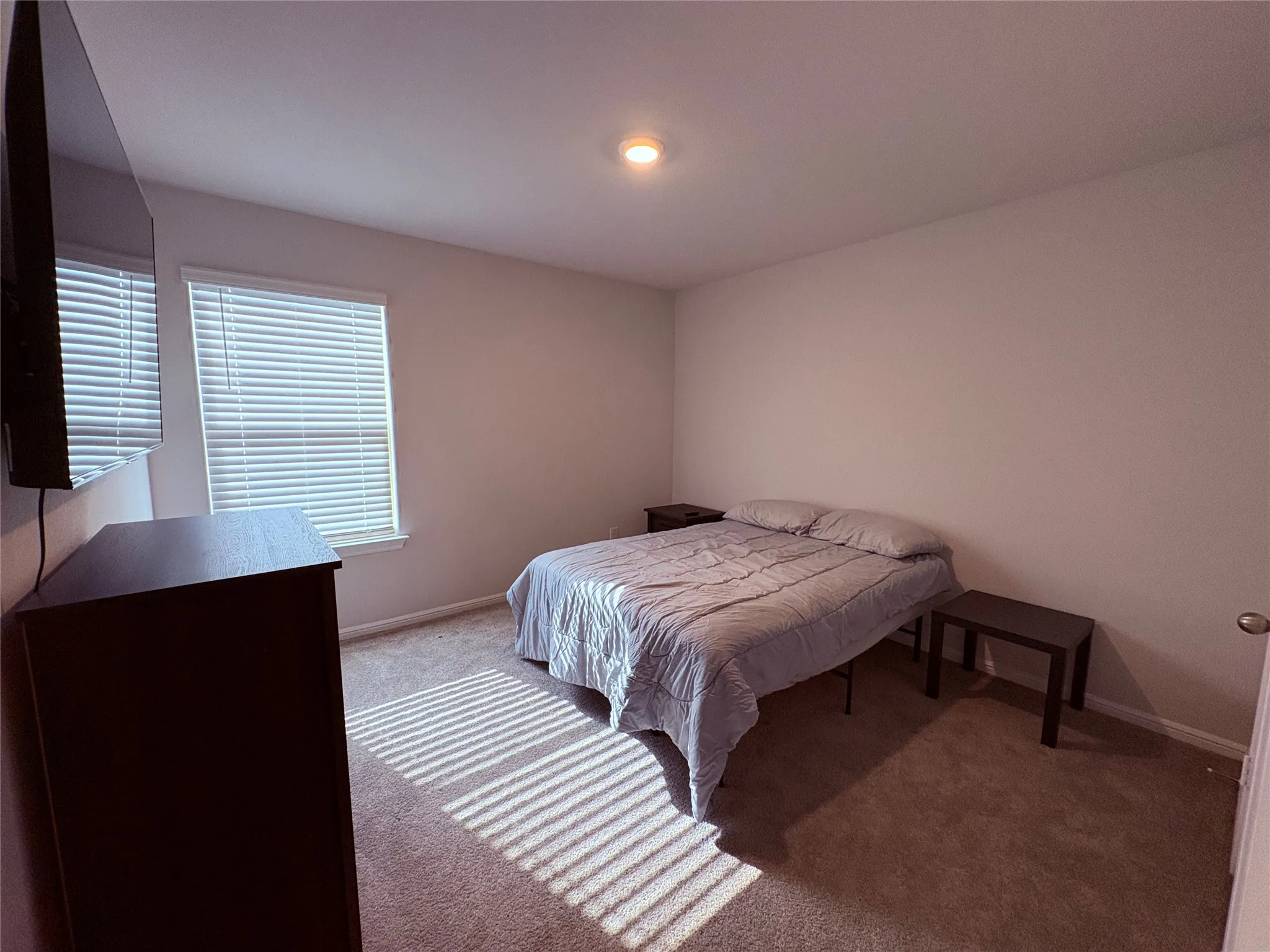 Wall-to-wall carpeting with a neutral color palette