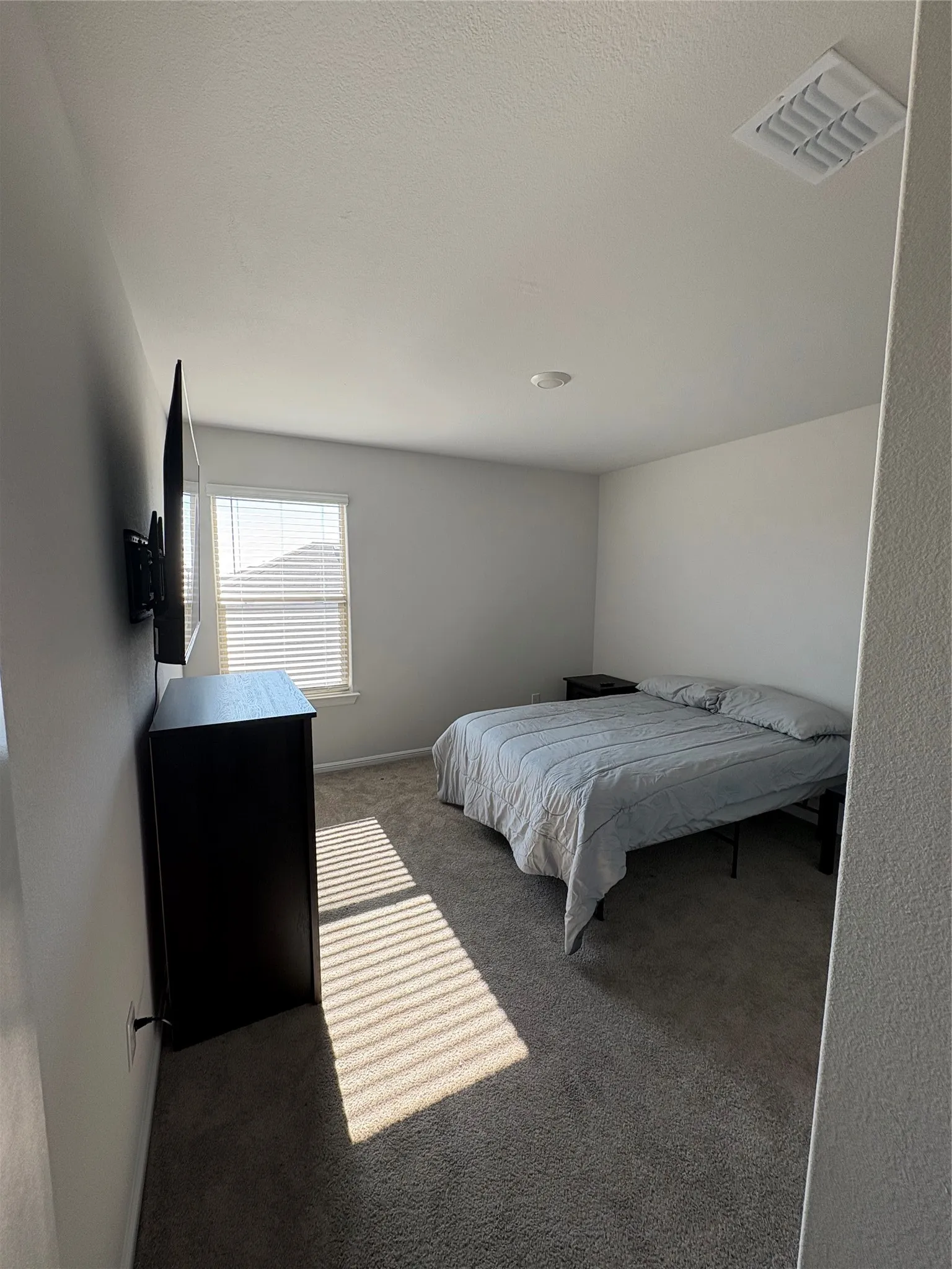 Textured carpeting throughout