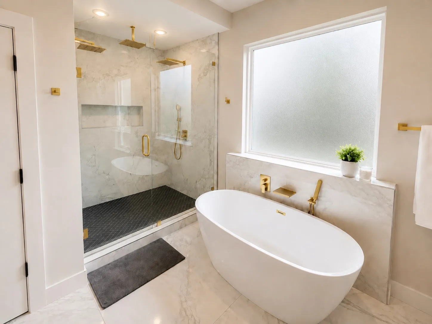 Freestanding soaking tub, walk-in shower with dual rain showerheads, stone-finish tile surround, and gold-tone fixtures