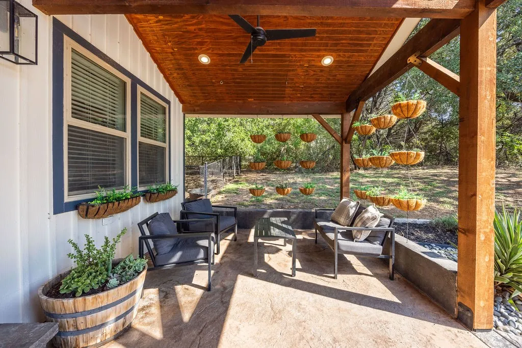 Covered patio featuring a wood-finish ceiling with recessed lighting and a ceiling fan, exposed wood beams, and a concrete slab floor