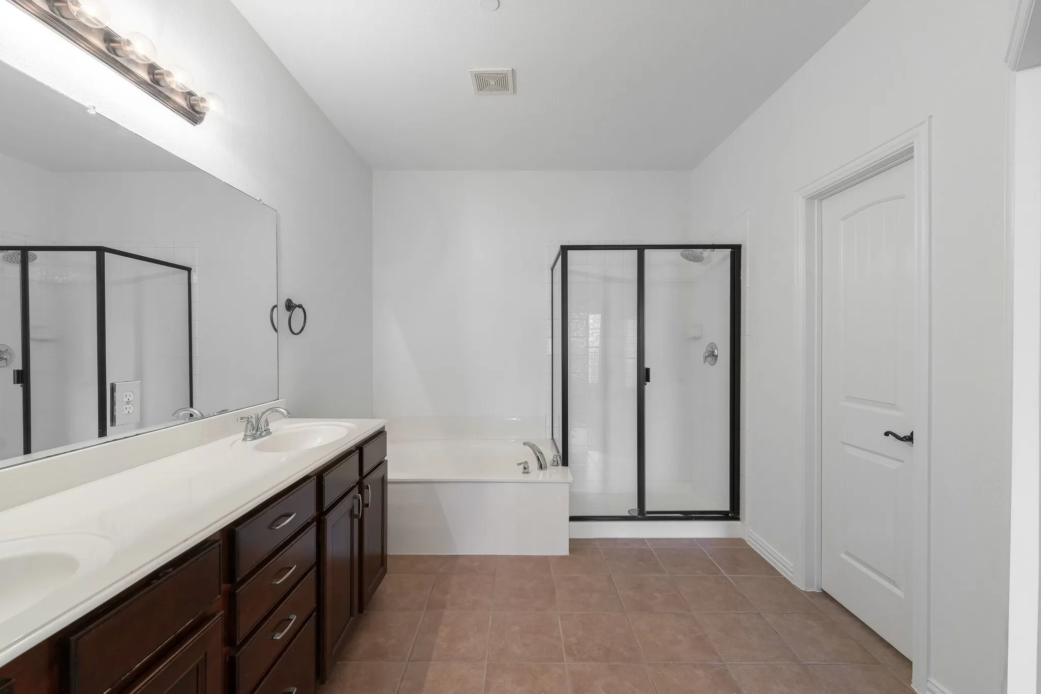 Primary ensuite with separate walk-in shower.
