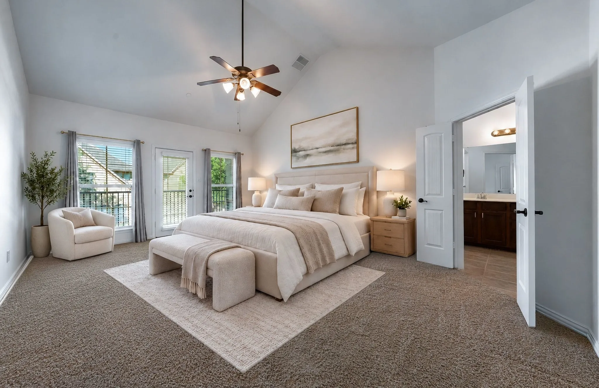 Virtually staged Primary Ensuite with Balcony Access.