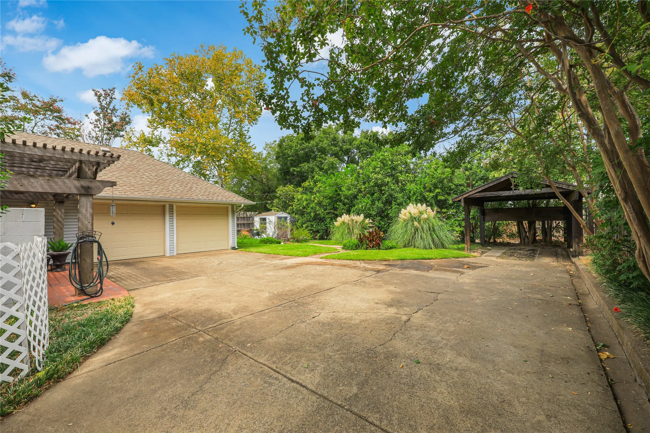 Views of the garage and parking area and extra playspace in the fenced  backyard!