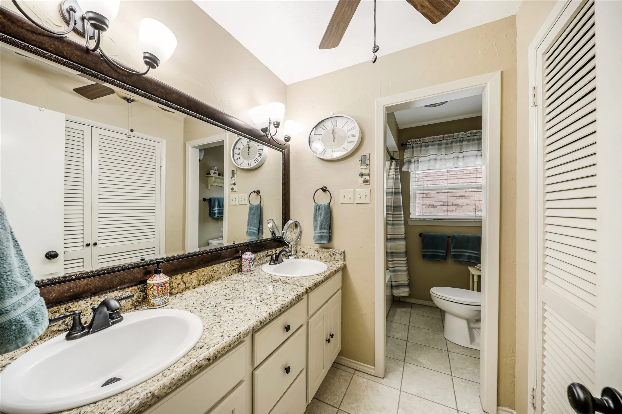 Dual sinks int he downstairs bath with granite counter tops and a ceiling fan as well! Tiled floors and tiled bath-shower!
Medicine and linen cabinet!