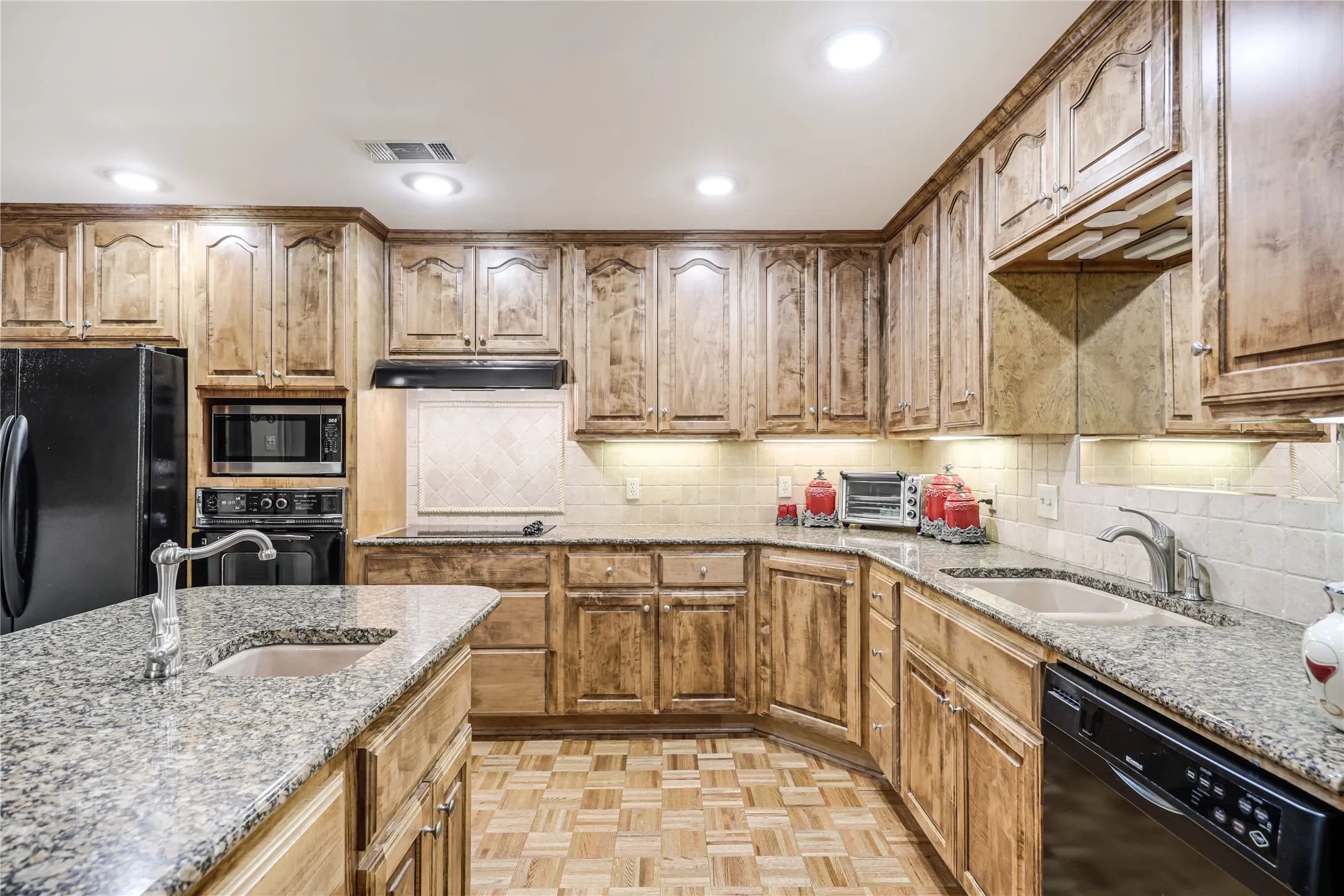 In the heart of this home and ideal for serving family and friends easy to move around in and serve two living areas, a breakfast area and outdoor patio for grilling and enjoyment as well!This lovely kitchen has been the heart of this home for the owners who have lived here for many decades to be able to serve their love of  family and their friends.