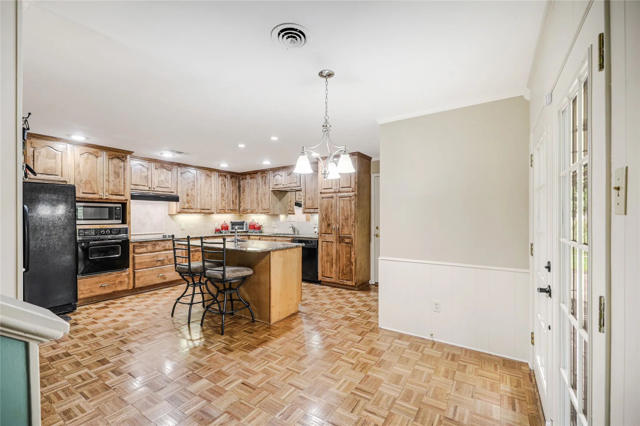 Views  of the island Kitchen- breakfast room with easy access to your garage!