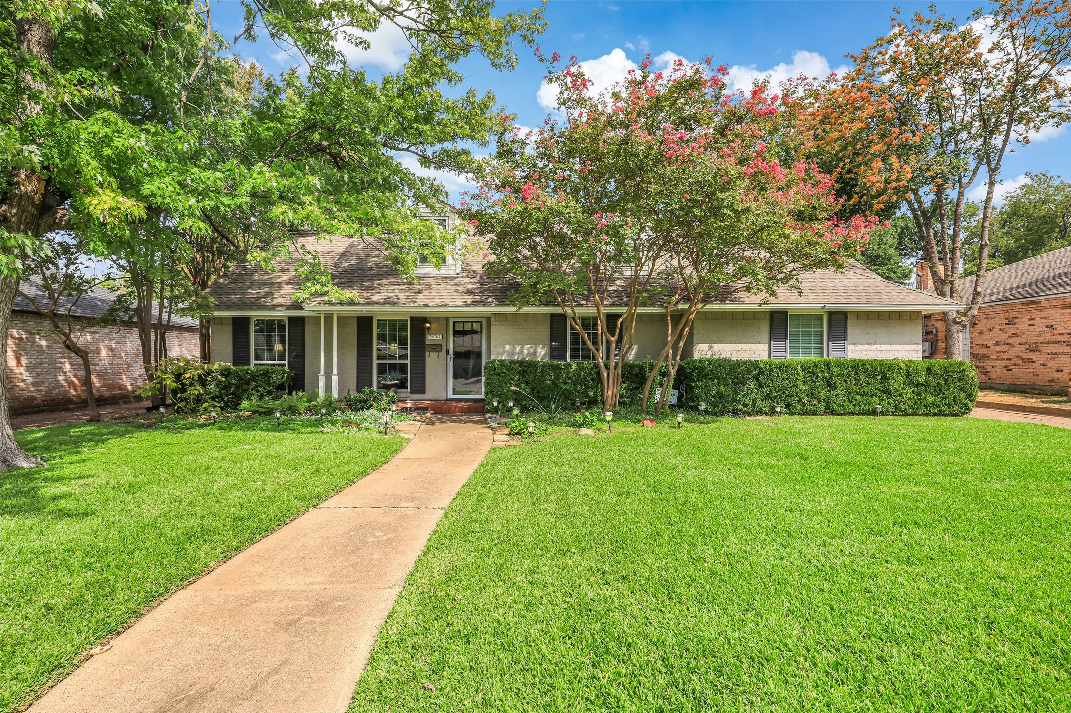 Four bedooms with two living areas and renovated kitchen opens to dining and breakfst area with easy access through french doors to outdoor patio area! Ideal for entertaining!