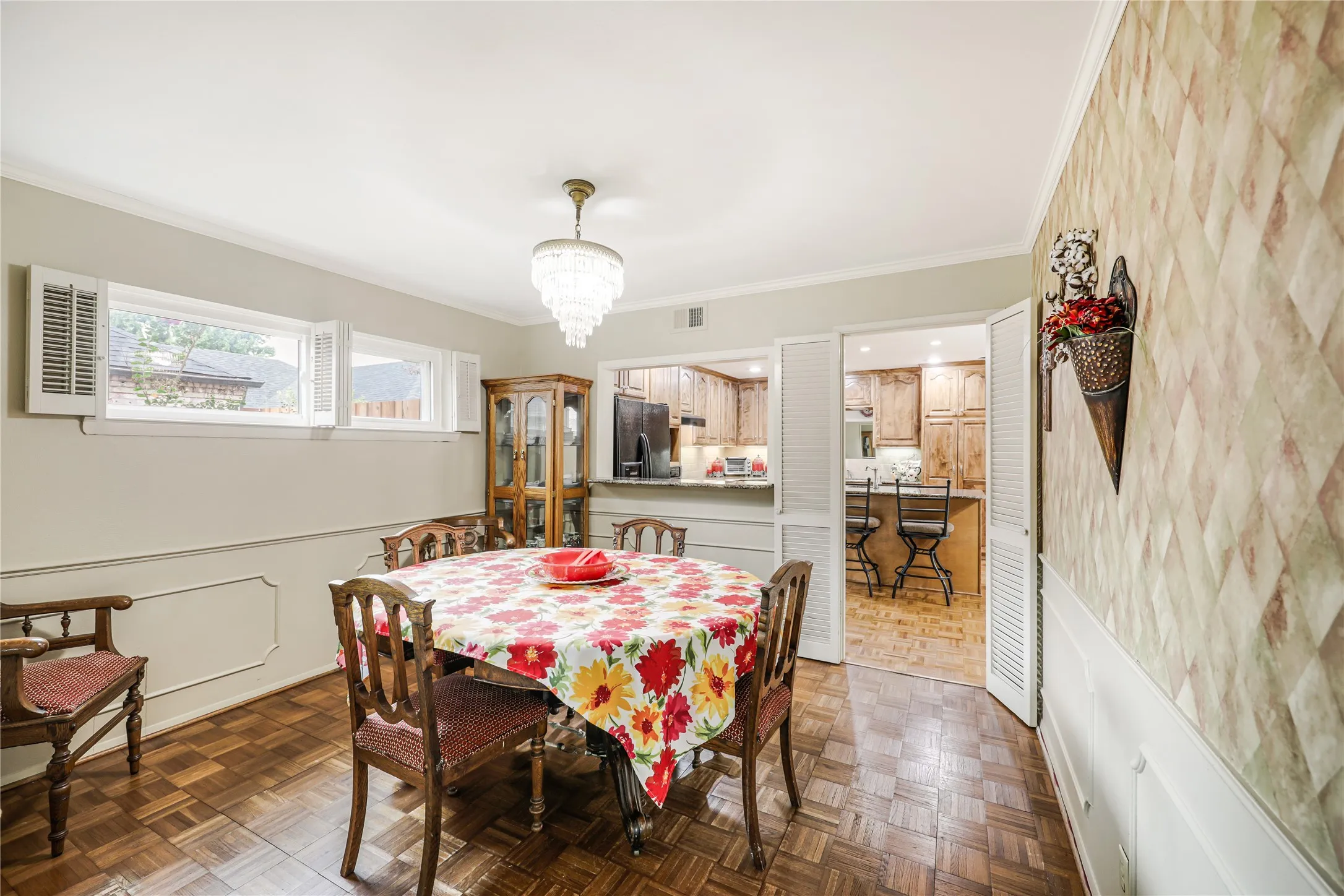 Easy access with a serving window from kitchen to the formal dining room and views of the spacious kitchen!  Ideal for entertaining!