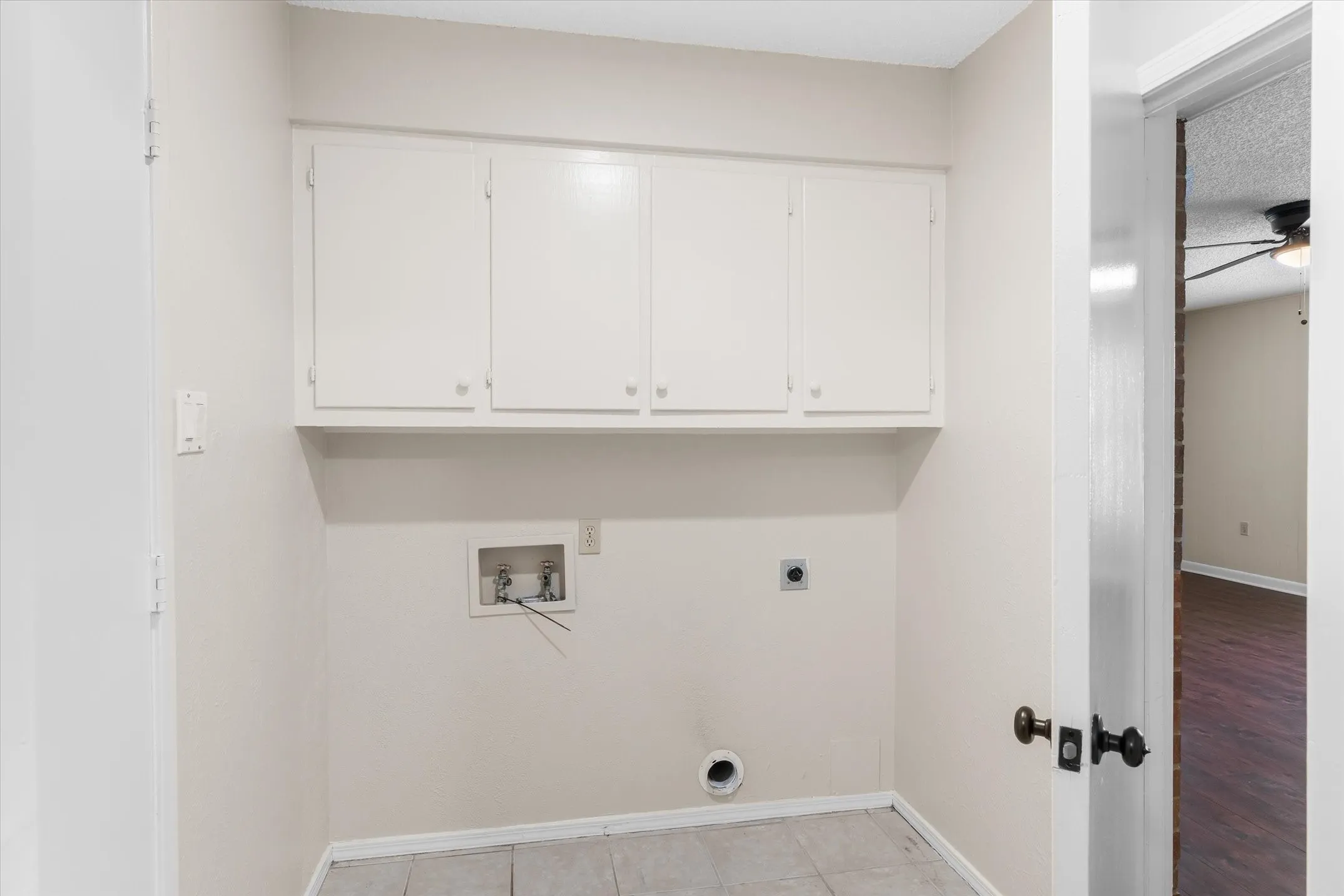 Just off the garage with upper cabinets