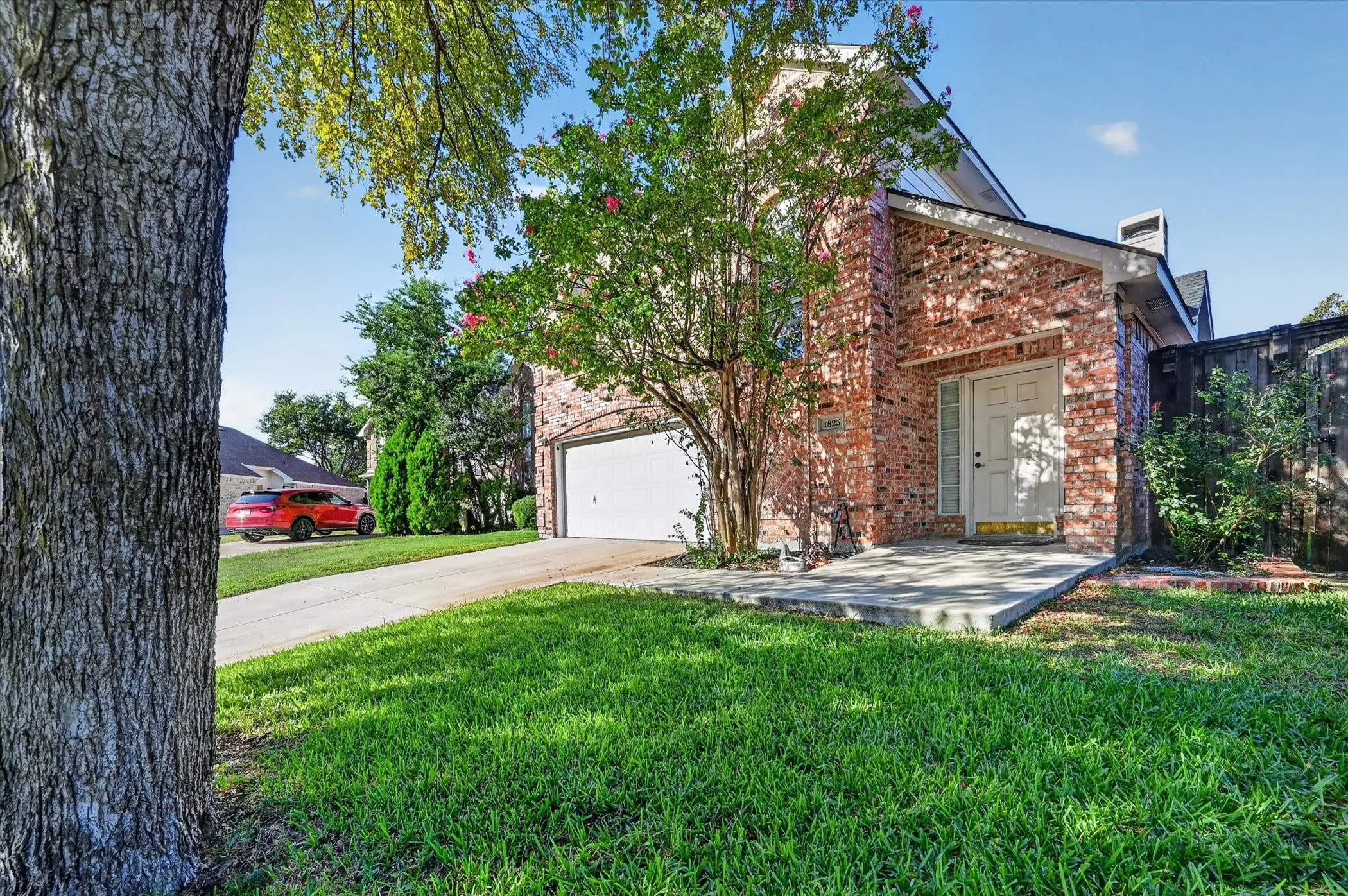 Red brick exterior with white trim