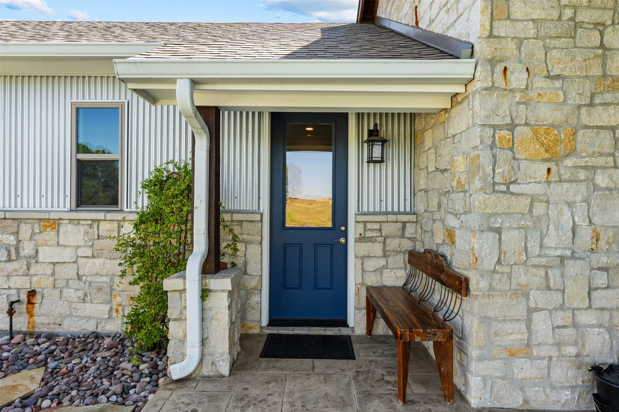 The blue door leads to the large mudroom.