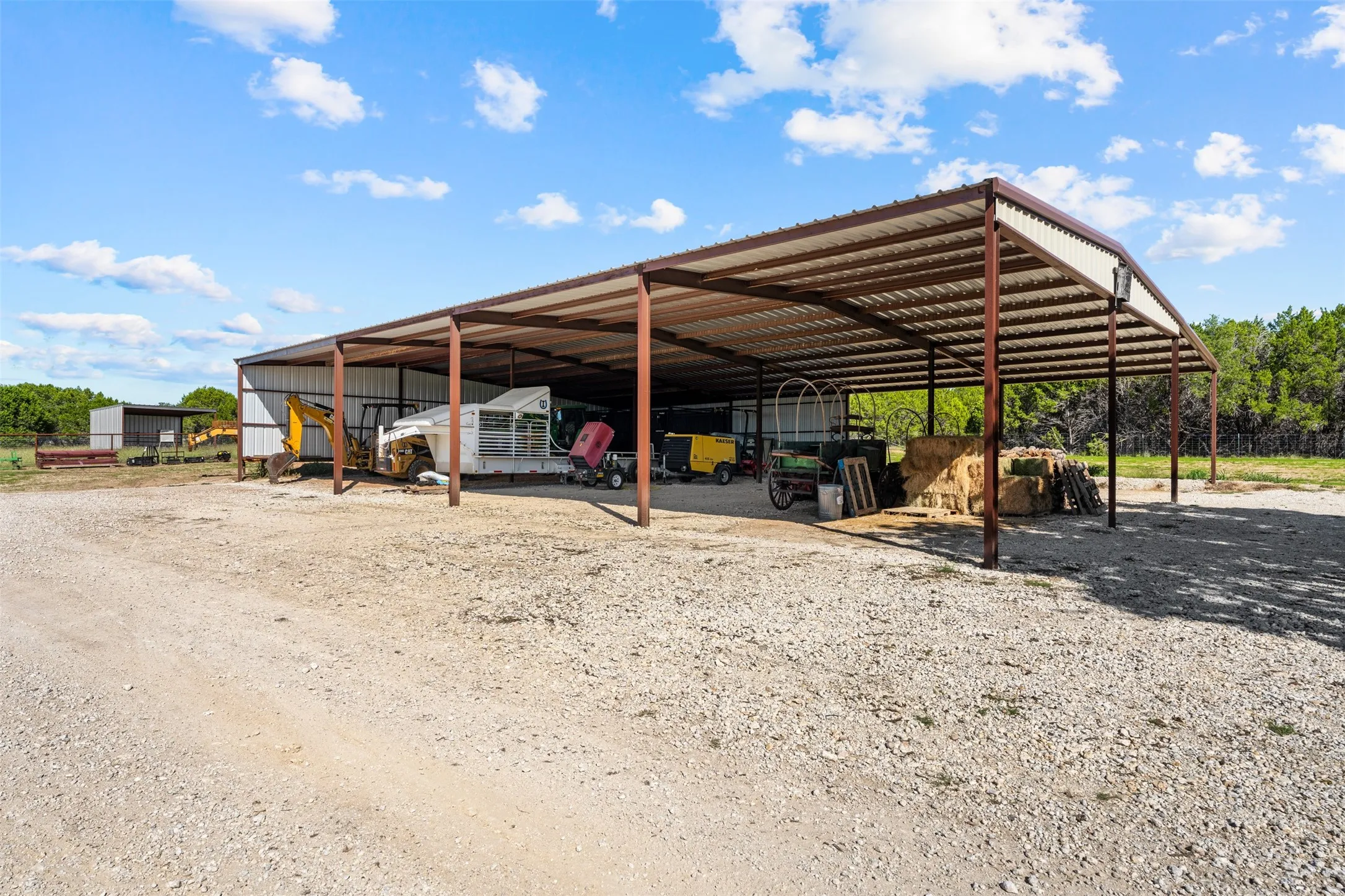 The equipment barn is the perfect place to keep trailers under cover and store implements.