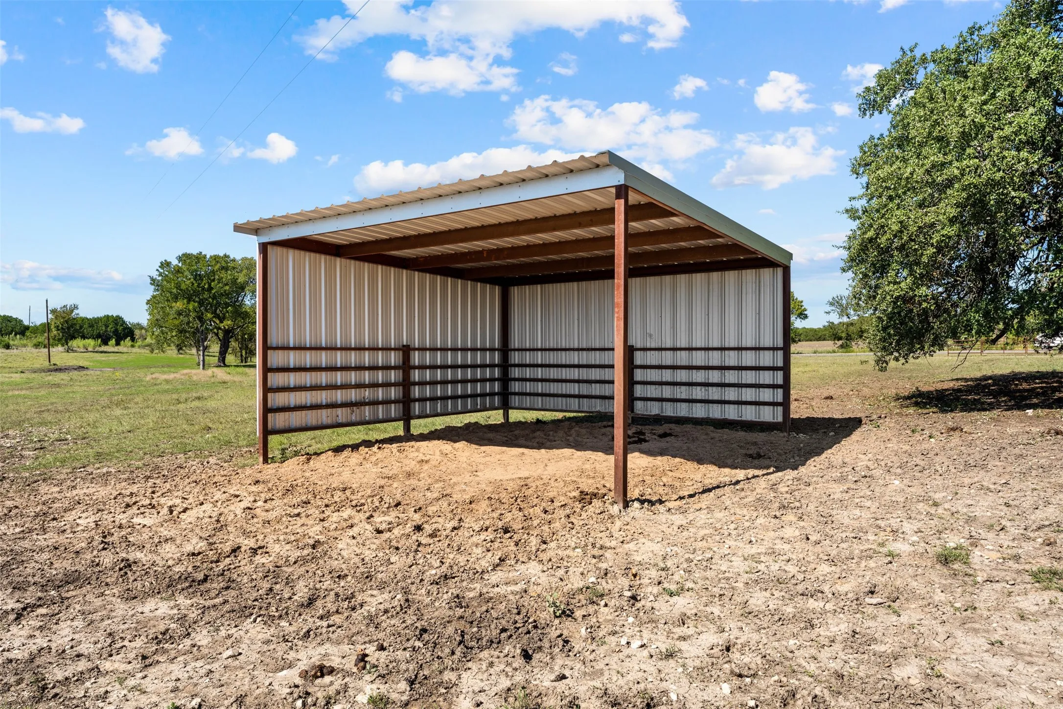 One of six loafing sheds for livestock that is currently used for horses.