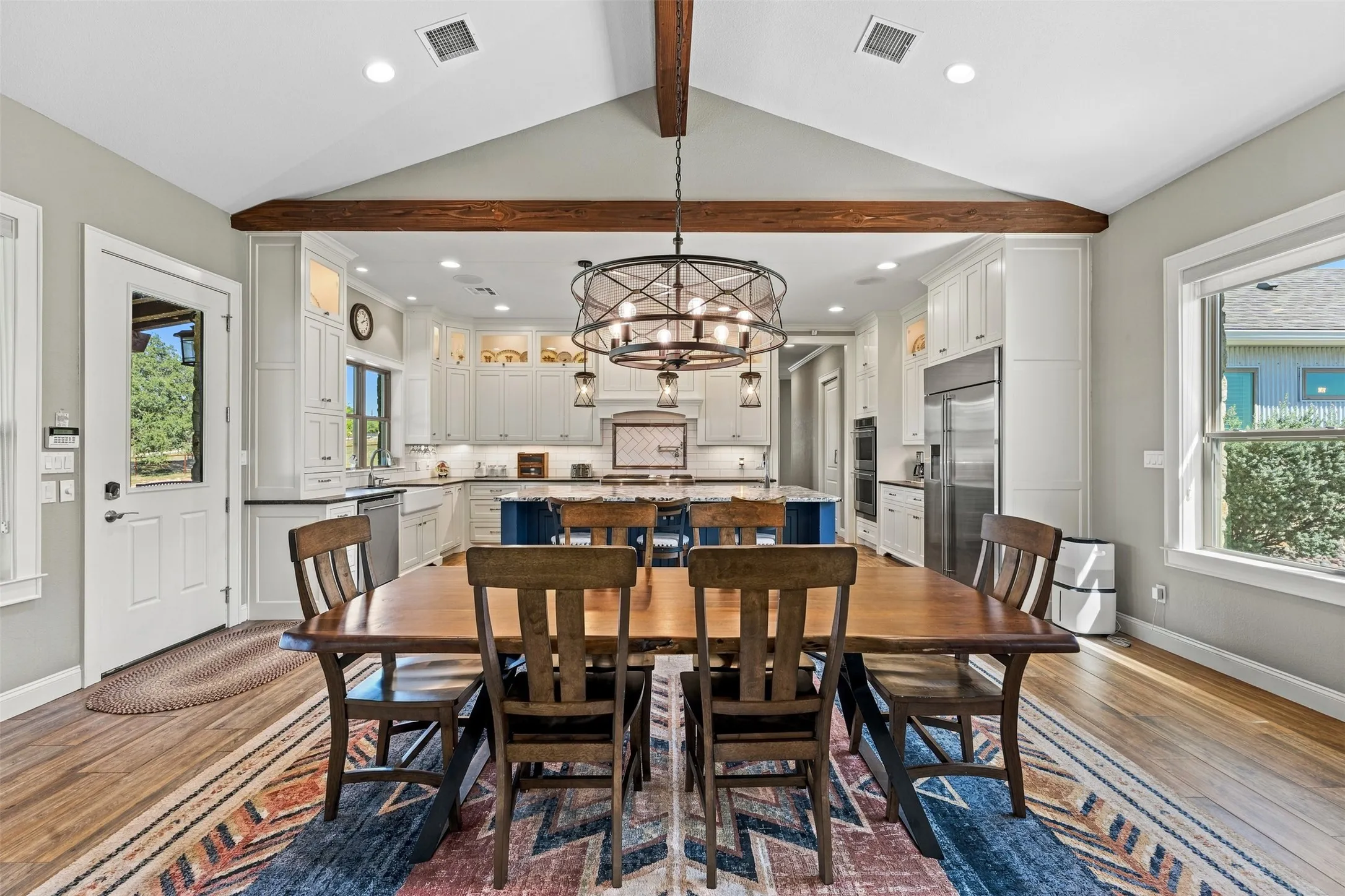 Gorgeous wood beams highlight the dining and living areas.