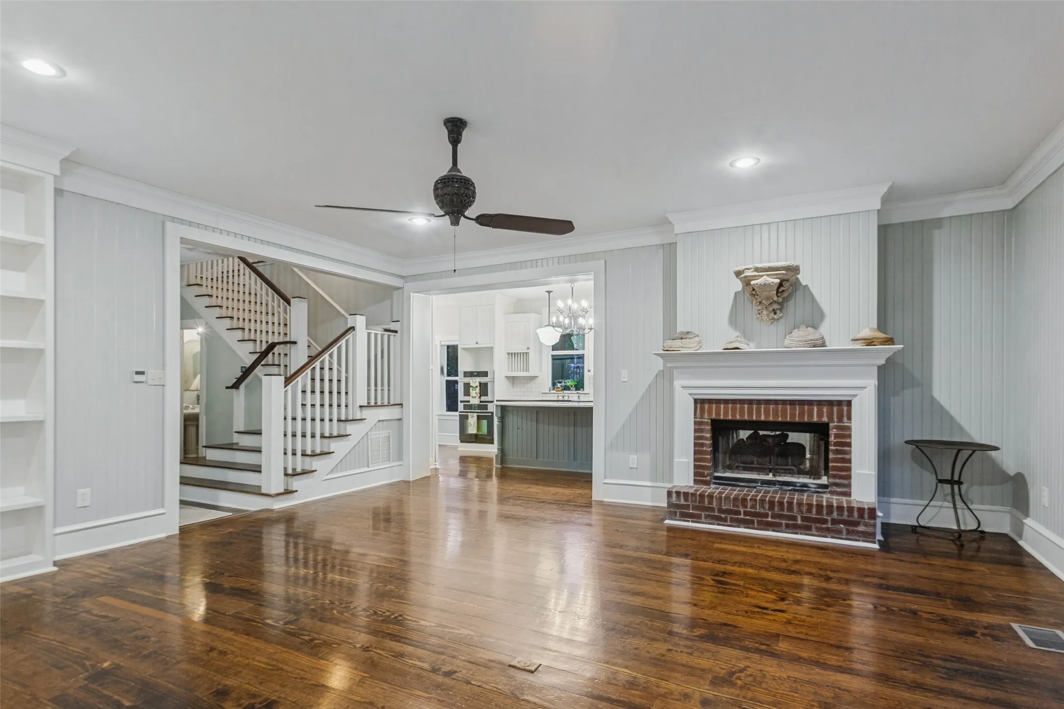 Living Room with views of the kitchen and main staircase