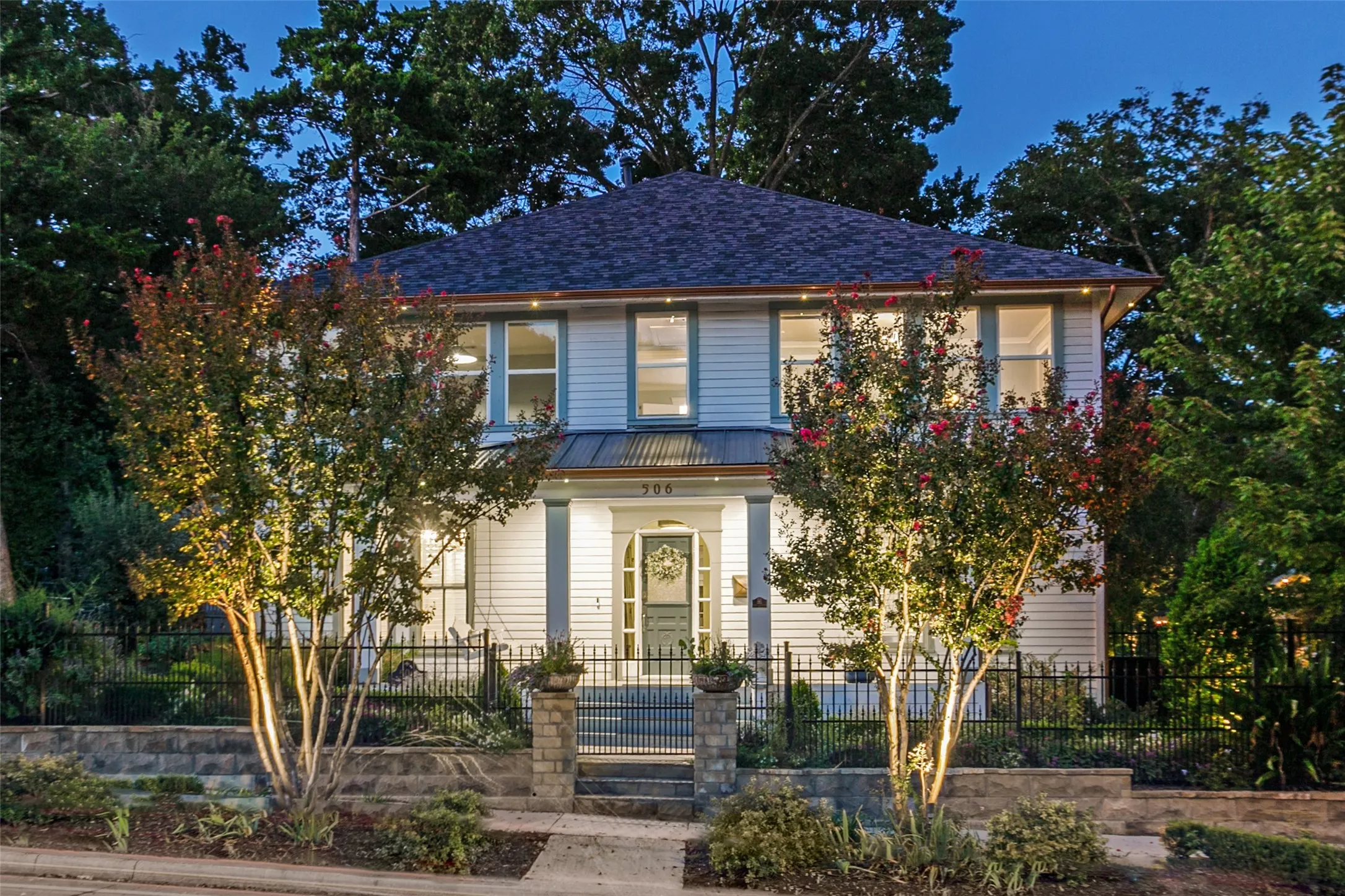Front of house and gated front yard