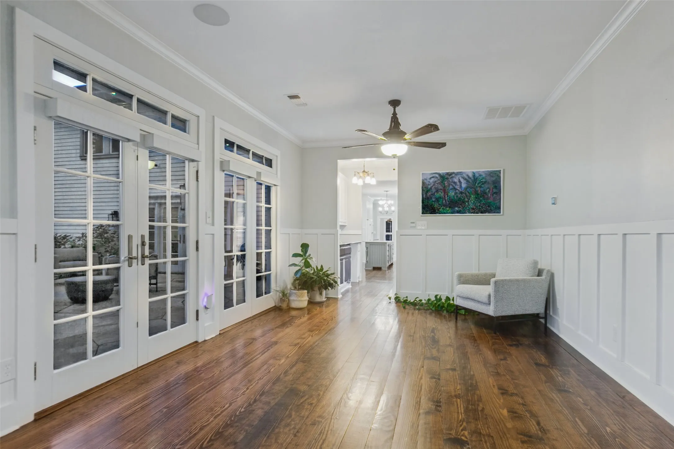 View of Solarium with french doors leading into back patio. Sonos speakers installed for music playing or TV watching