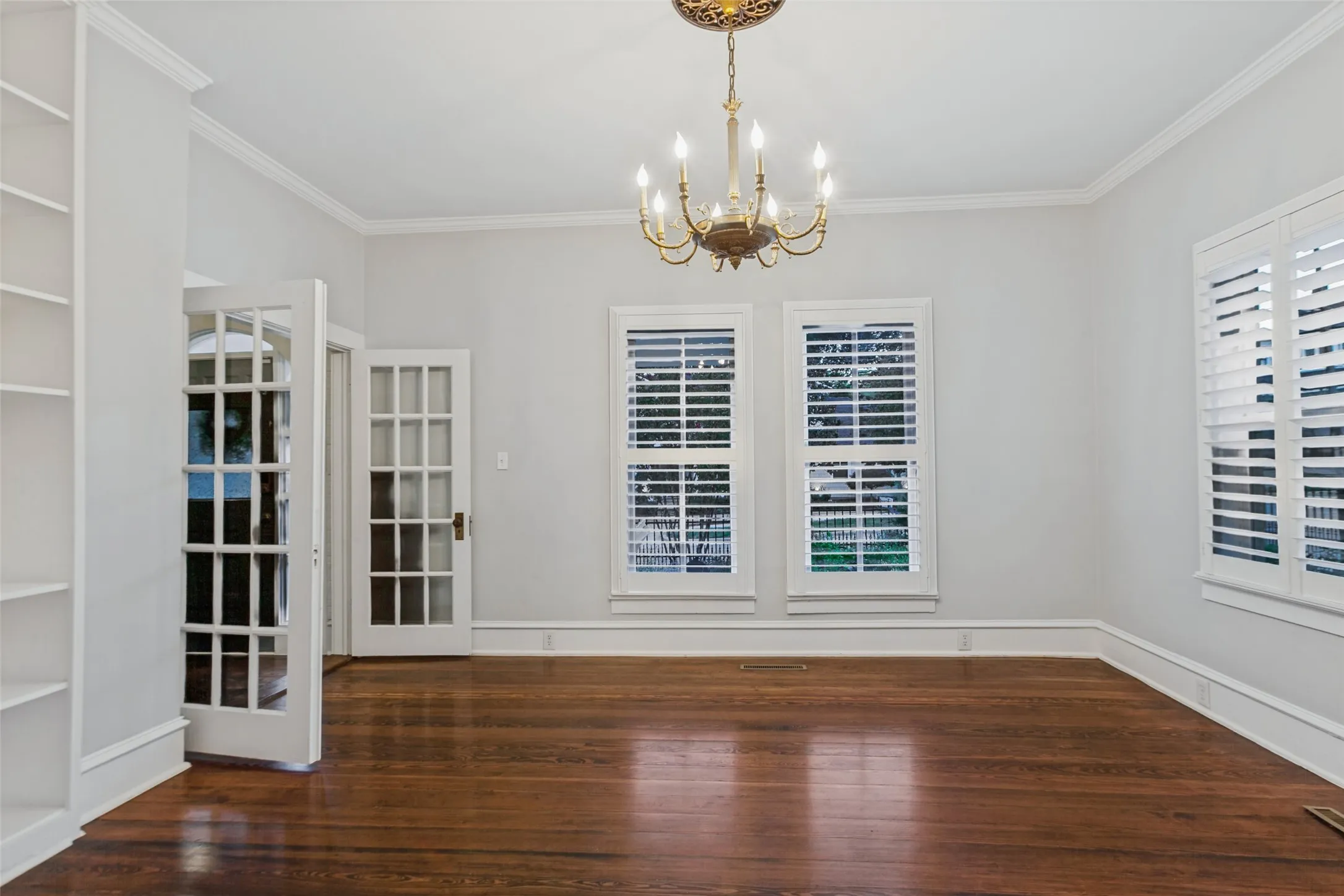 Dining room located in front of the house off main entryway with plenty of built in shelves for storage and decoration