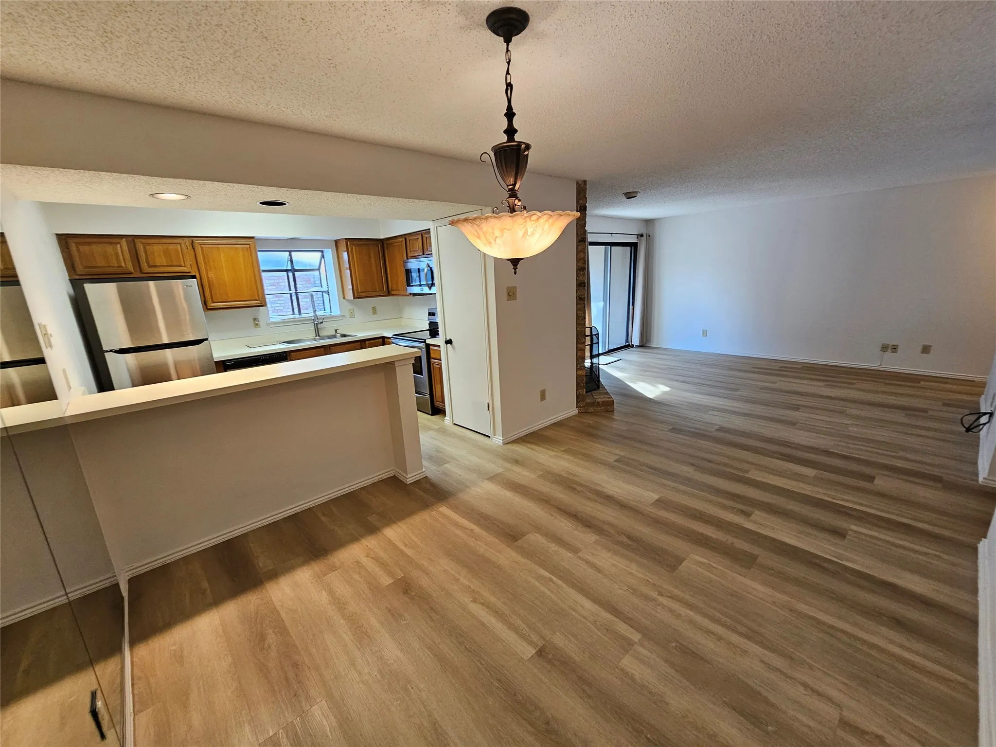 Dining area with bar eading to kitchen