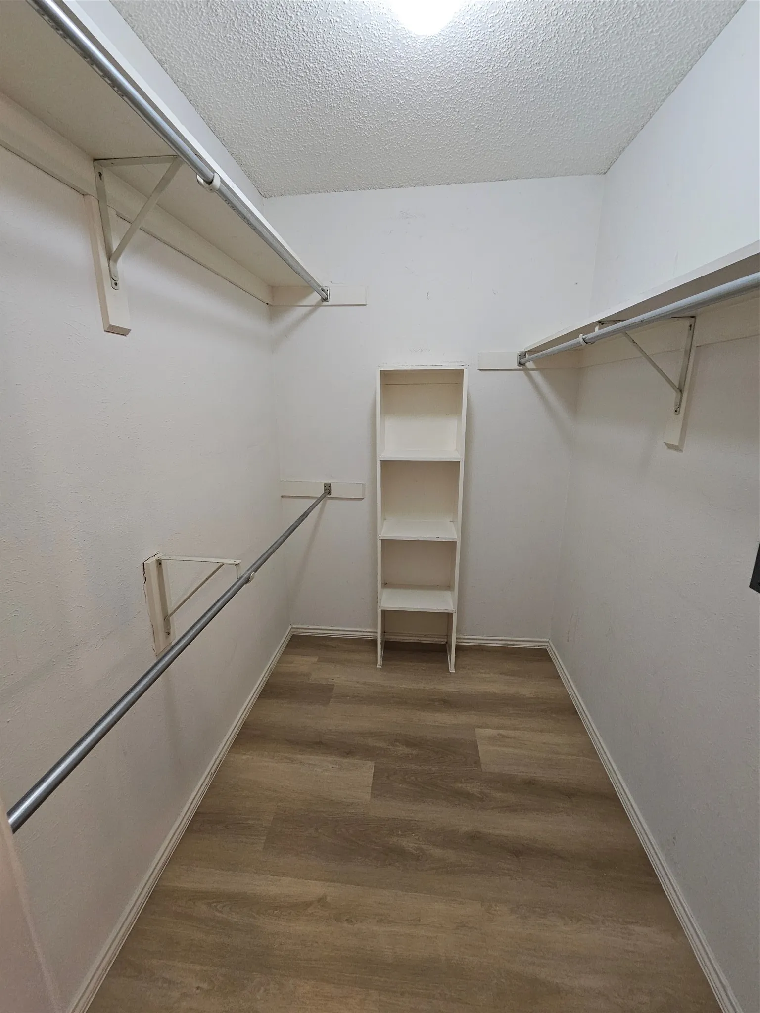 Primary closet with shelving