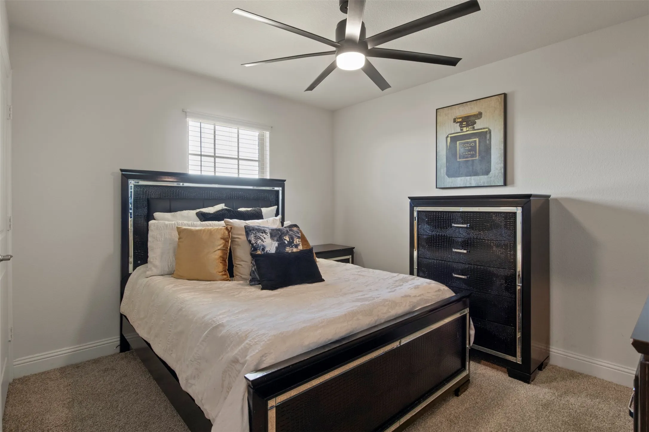 Recessed window with blinds, overhead ceiling fan with lighting, and light-toned wall paint