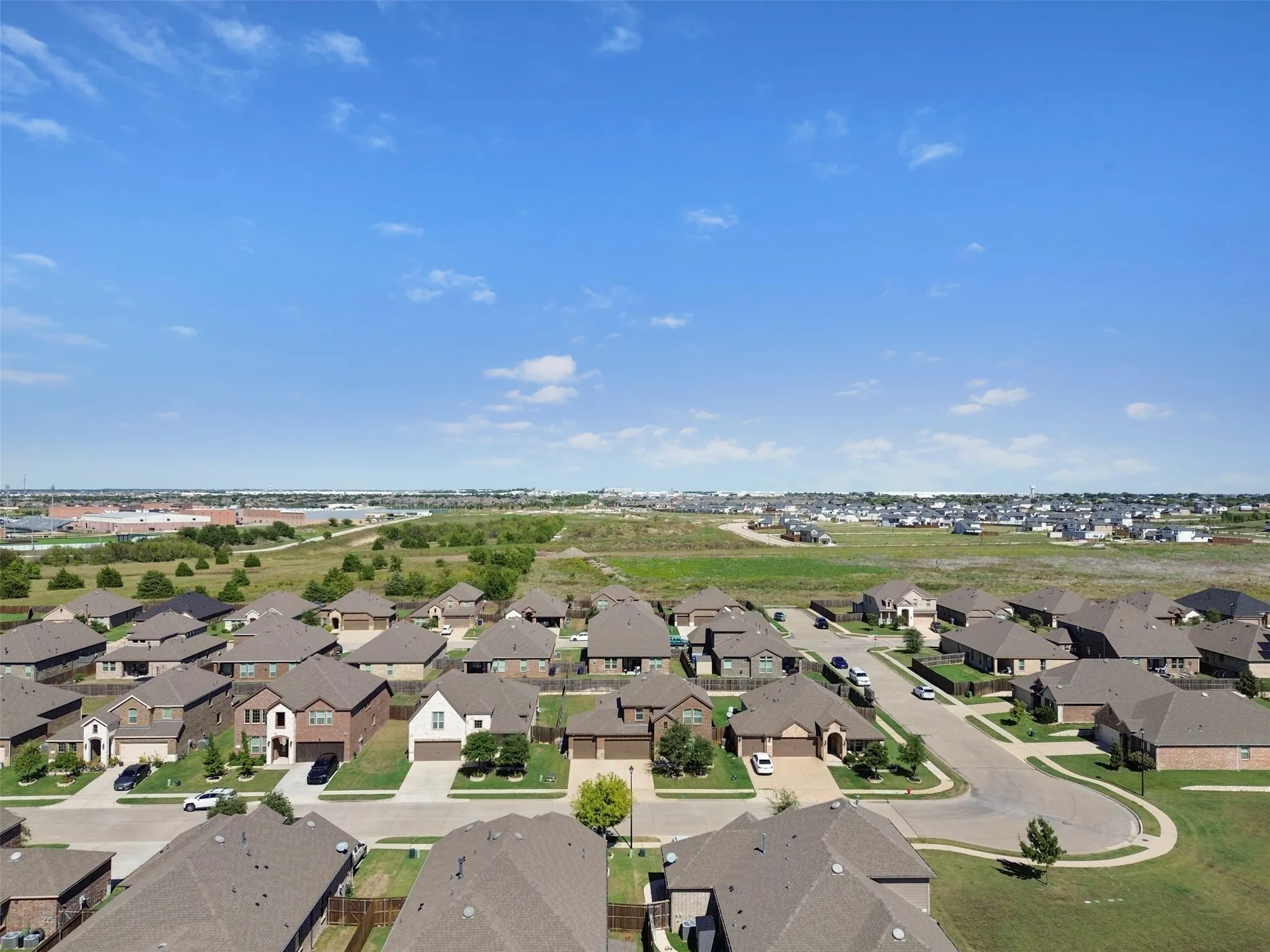 Established residential neighborhood with curvilinear streets and a mix of single-story and two-story homes