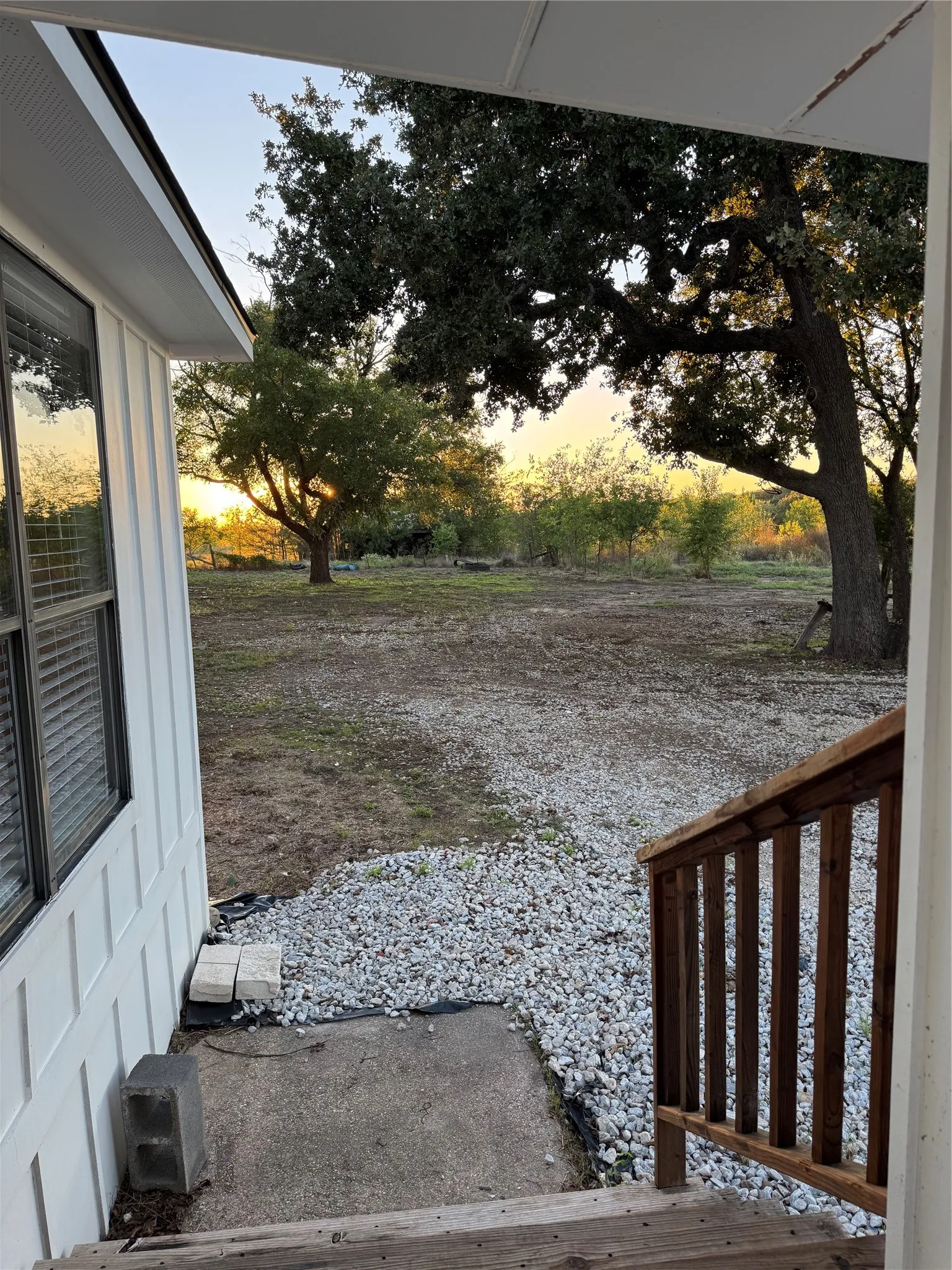 Wood-finish porch with a wooden railing