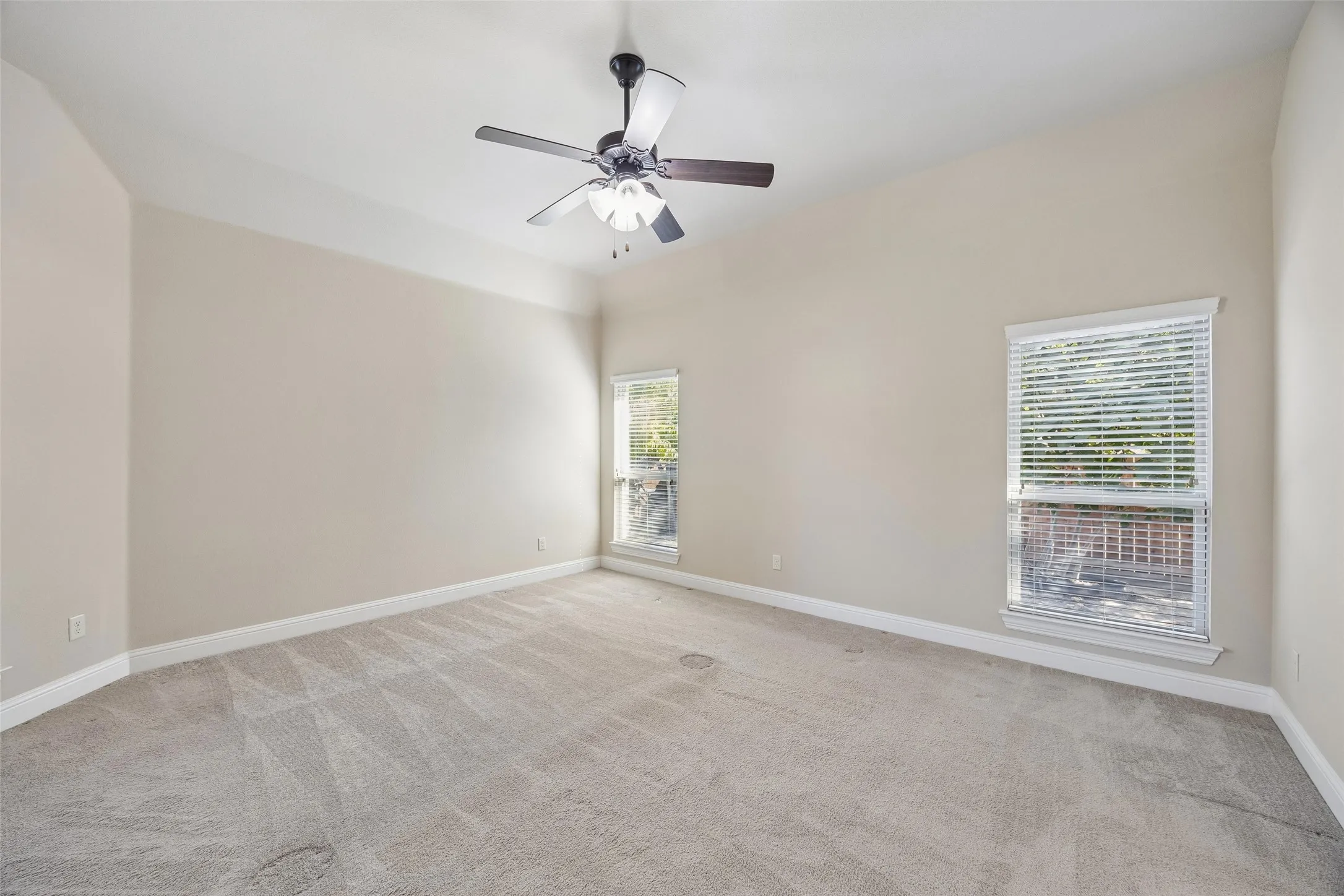 Spacious primary bedroom at the back of the home.
