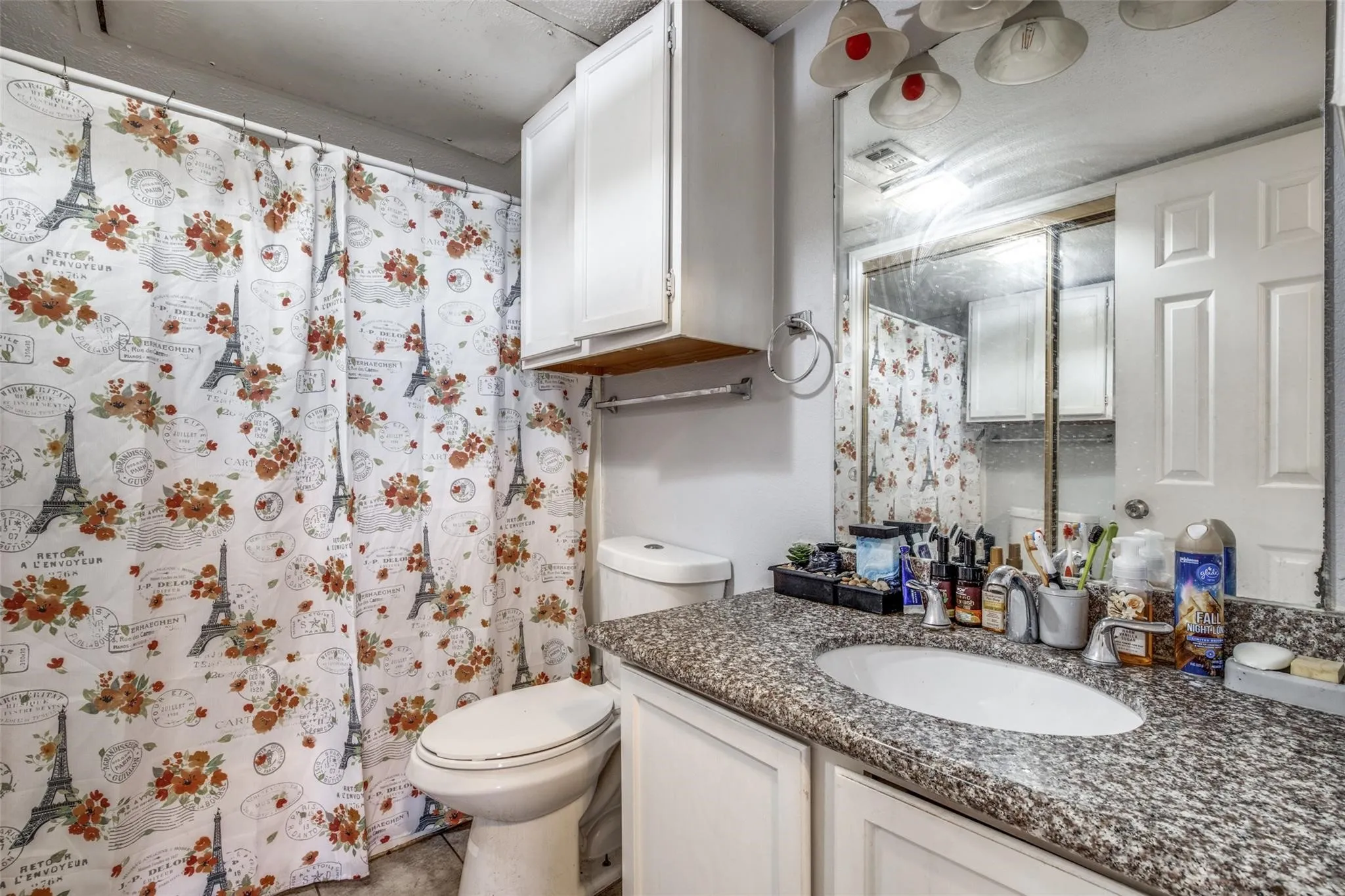 Vanity with a granite-look countertop and an integrated oval sink