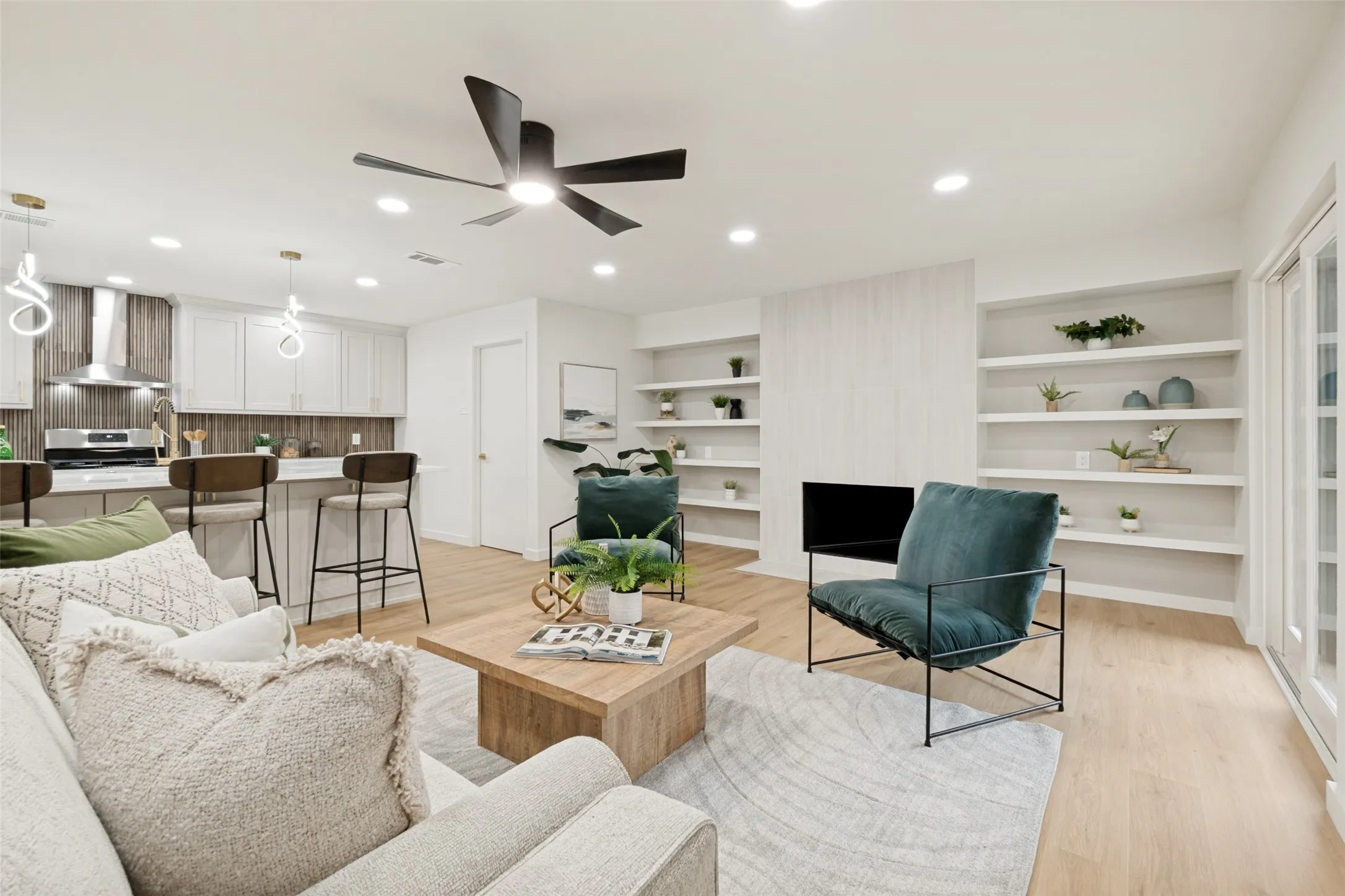 Open to kitchen with view of fireplace