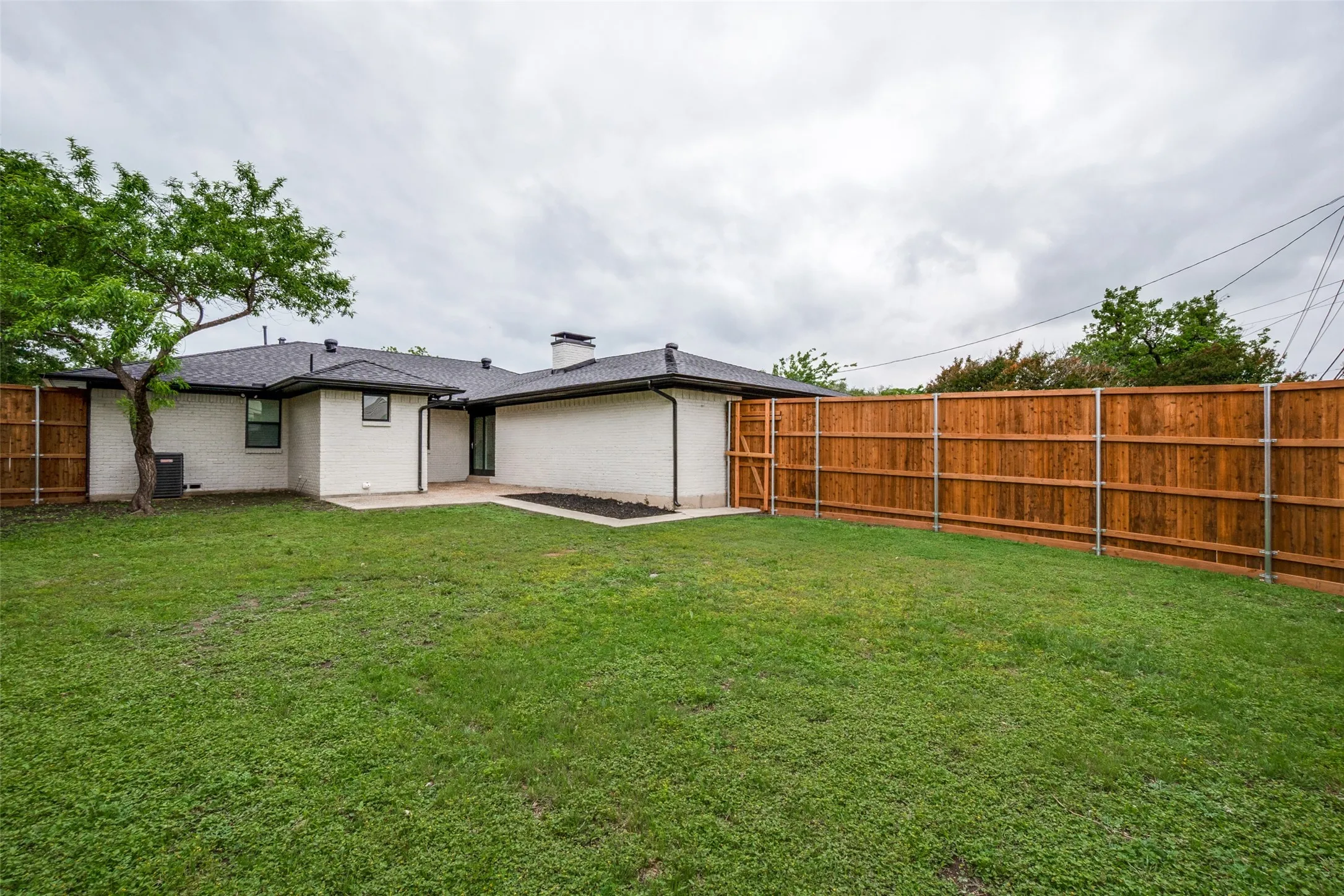 Large backyard with privacy fence