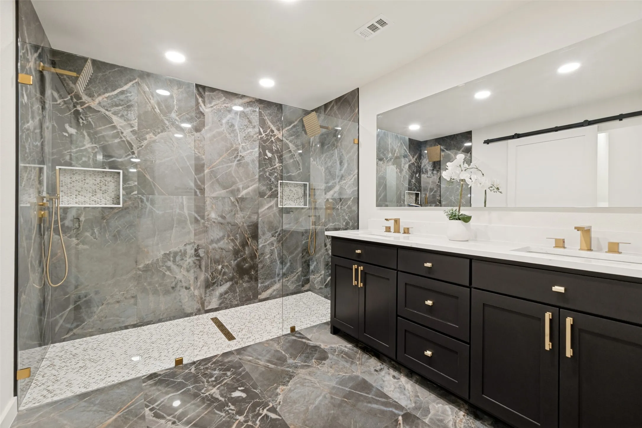 Large walk in shower and double vanities