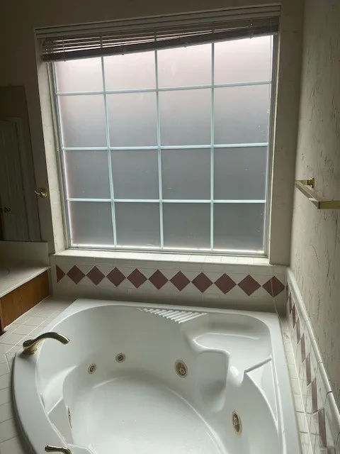 new frosted glass window over tub