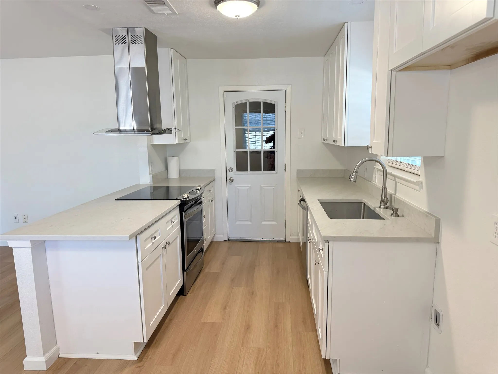 Additional view of kitchen and work area.