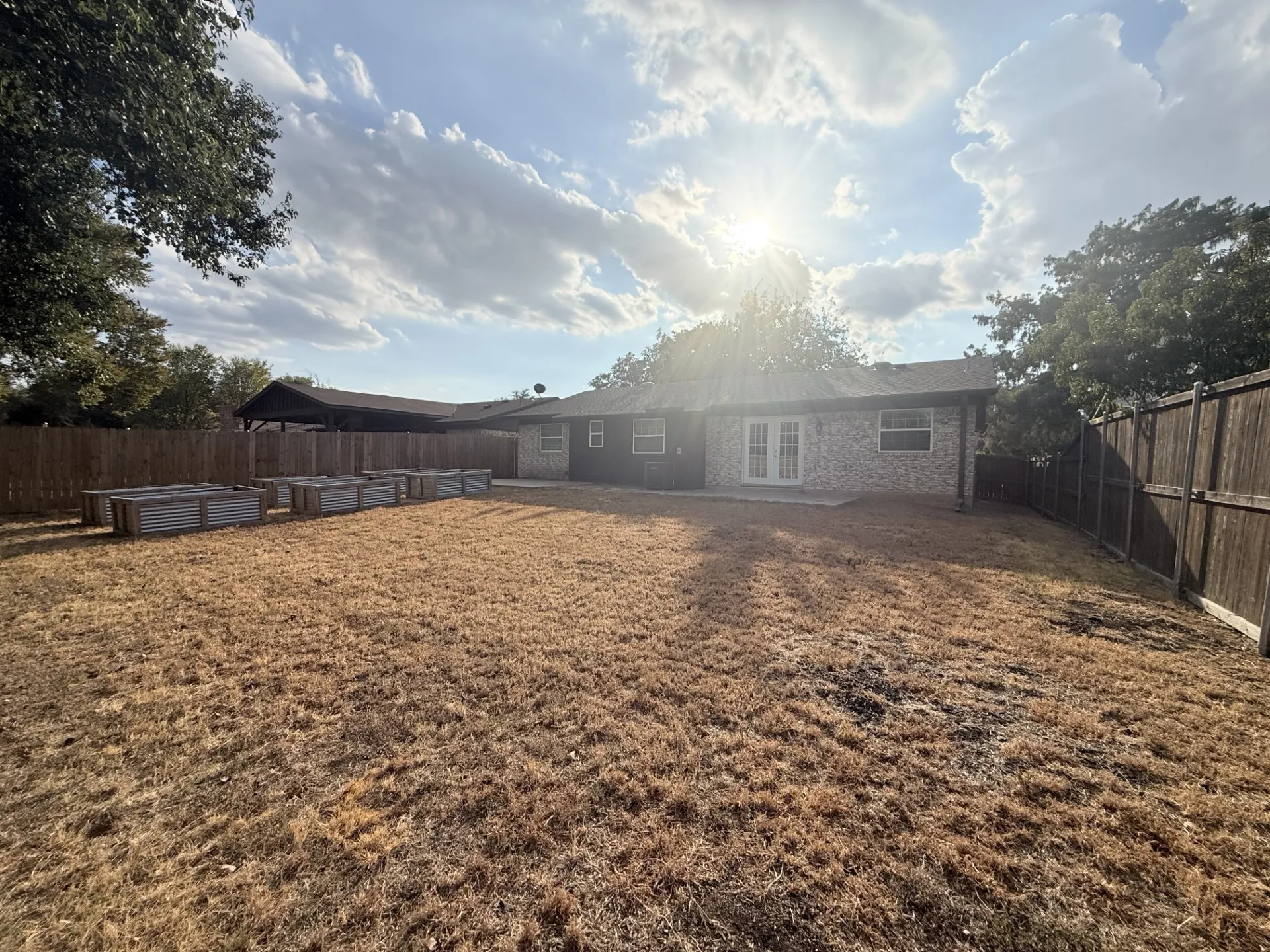 Oversized fenced lot.