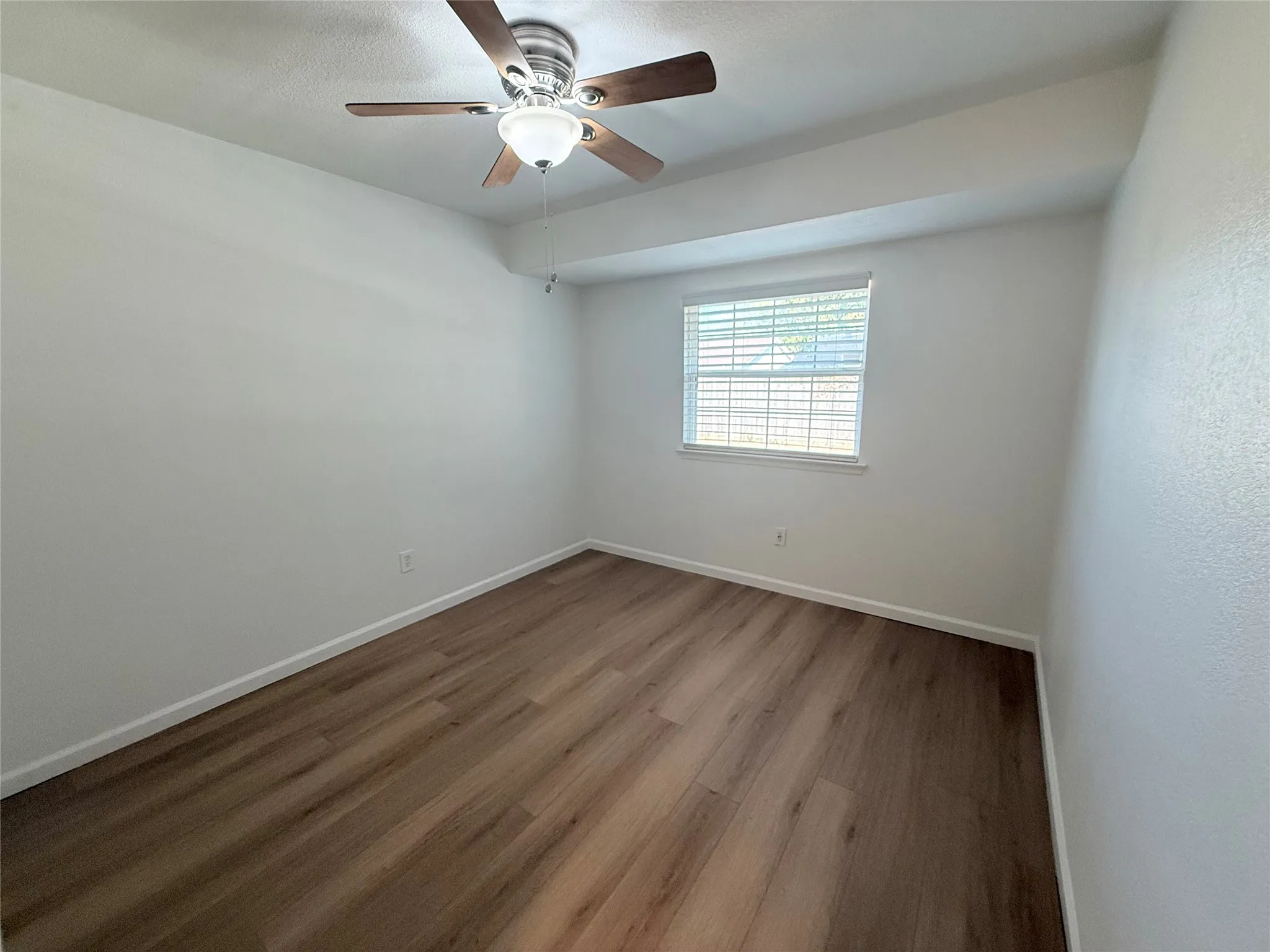 Secondary bedroom. Fresh paint and new flooring.
