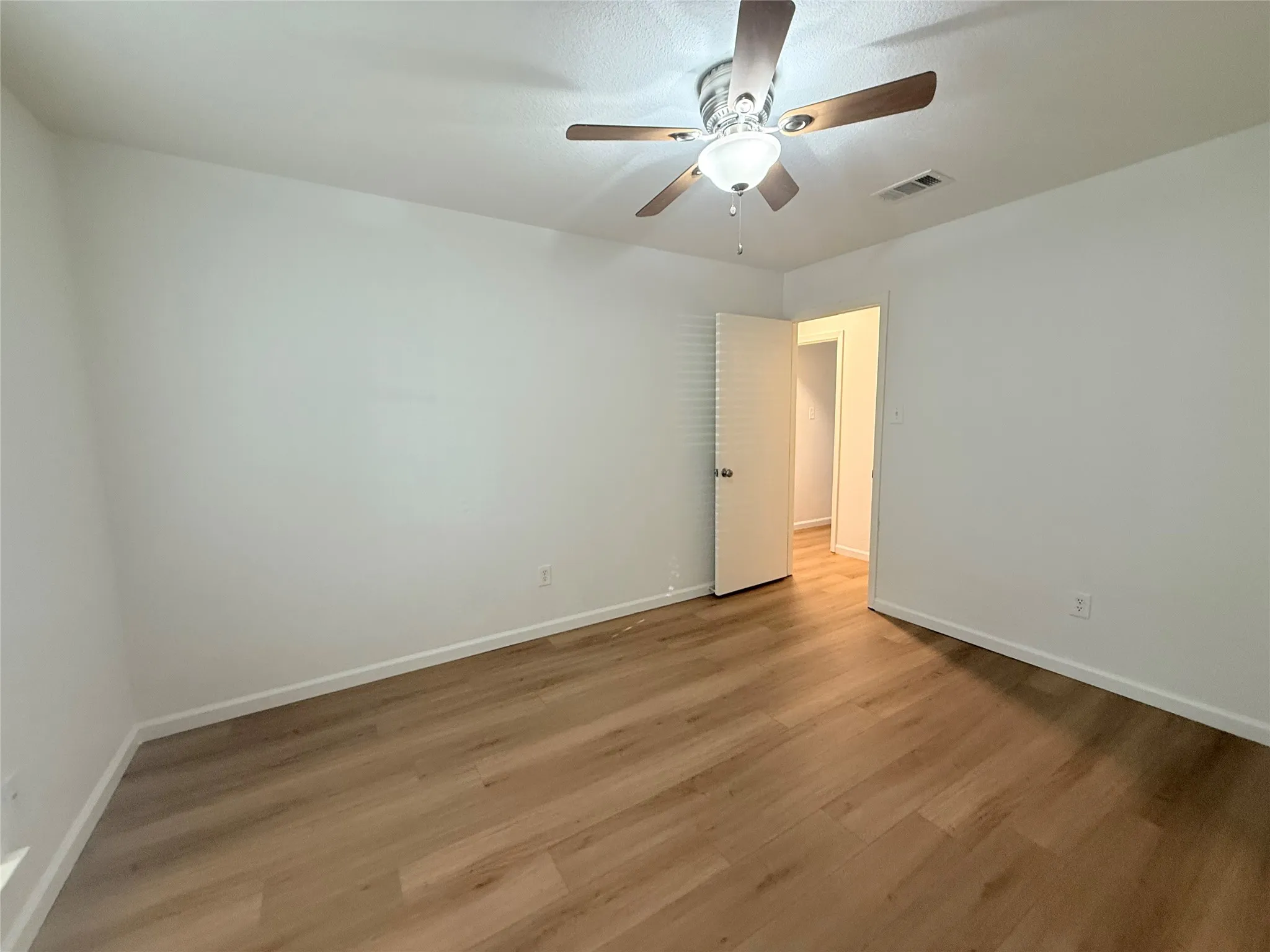 Master bedroom. New fans, fresh paint and new flooring.