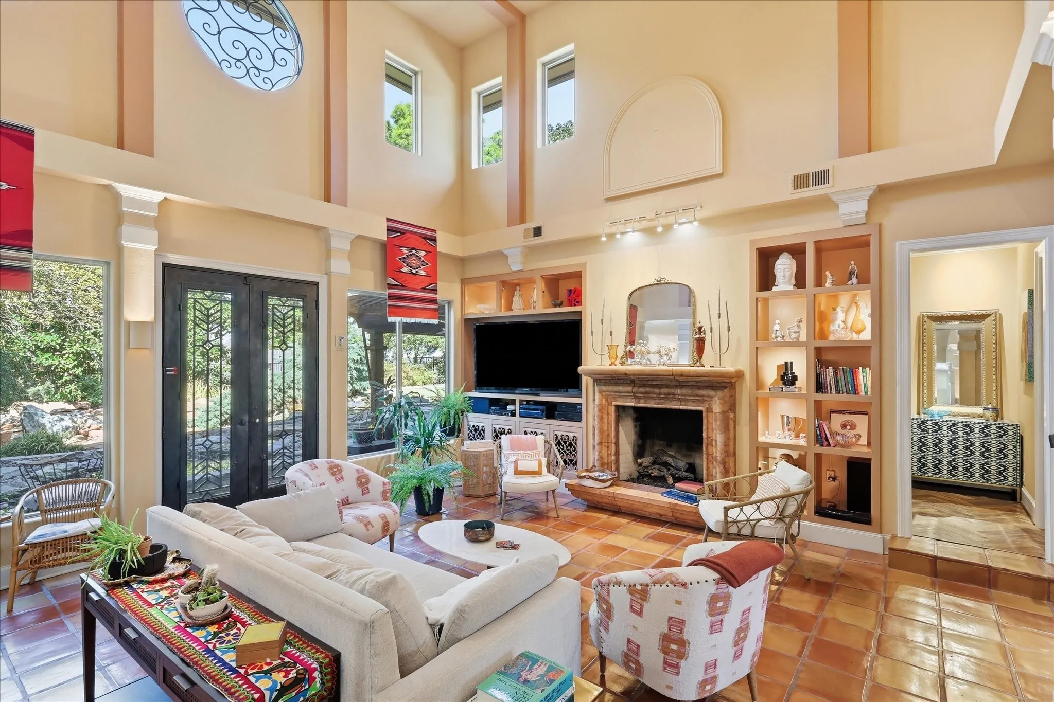 High ceilings with decorative archway and upper windows